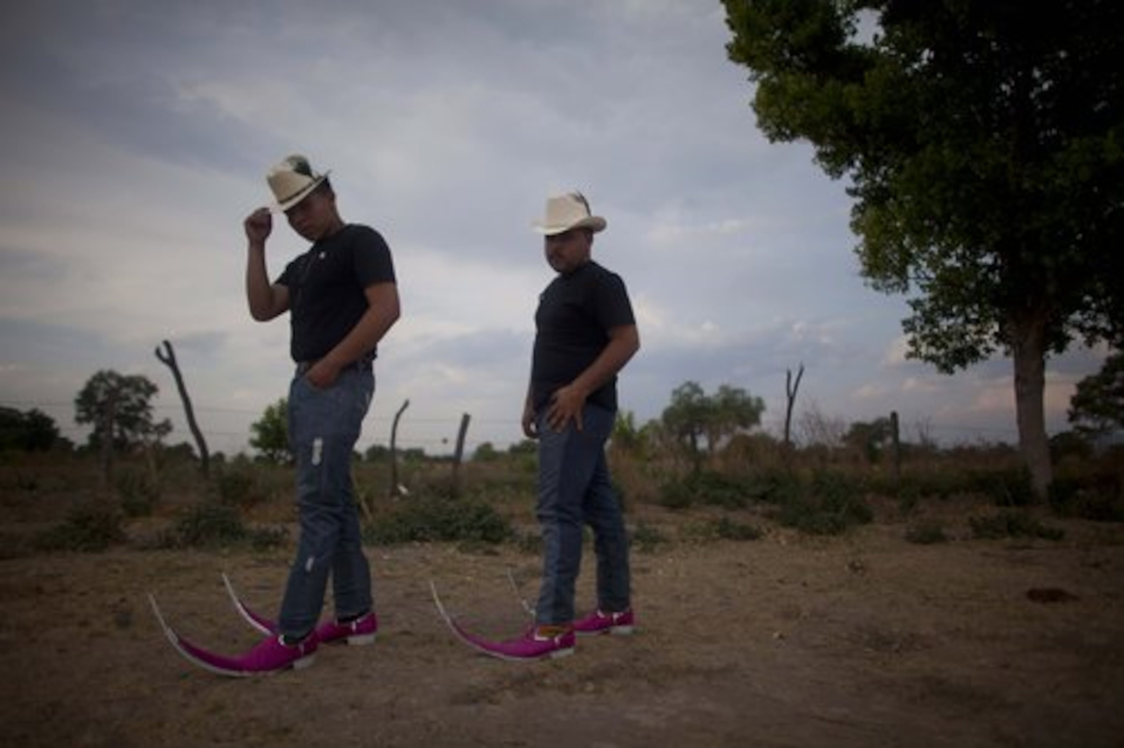 Jose Miguel Hernandez Castillo, 20, left, and Luis Alberto Alvarez Gallegos, 16, both belonging to the "Parranderos" dance crew, pose for a photo wearing their pointy boots in Matehuala, Mexico.