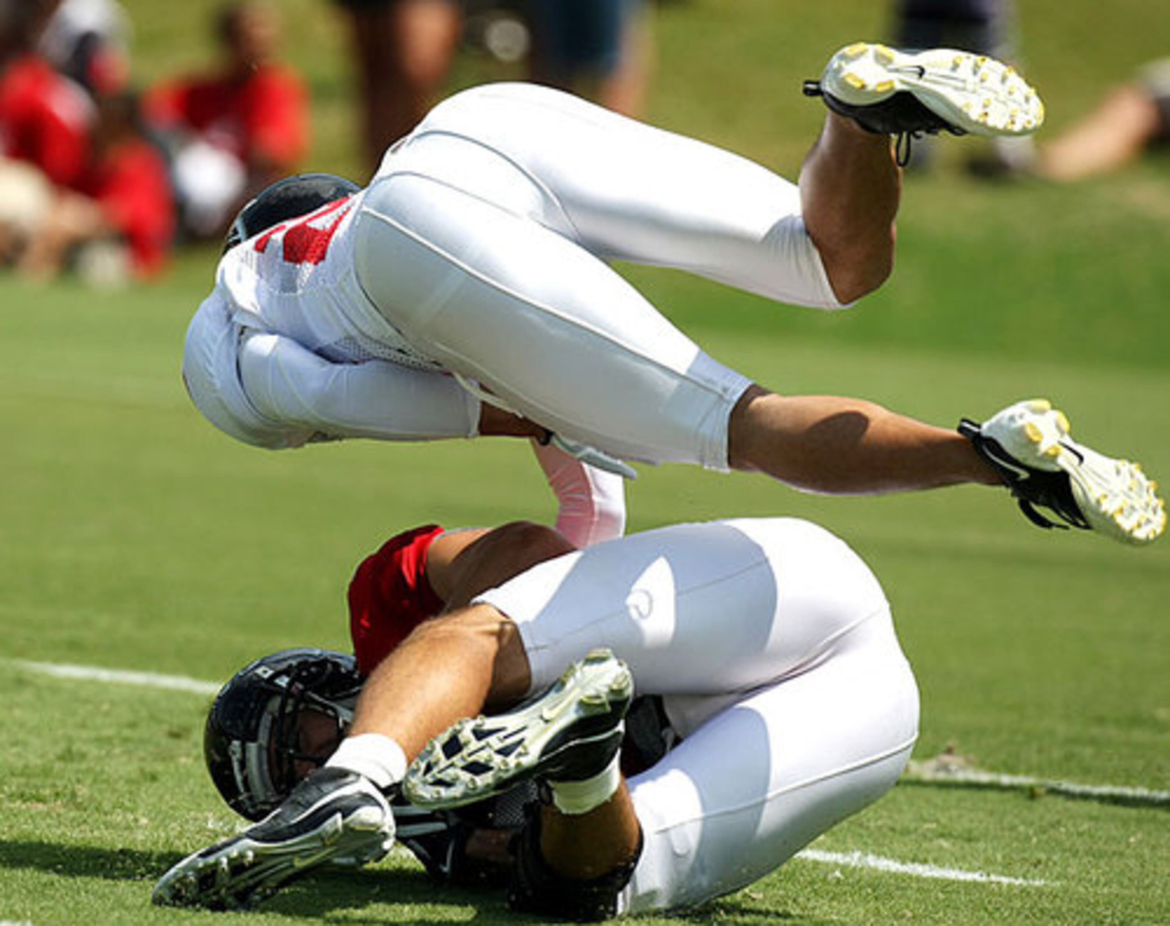 Falcons cornerback Brent Grimes levels wide receiver Brian Finneran.