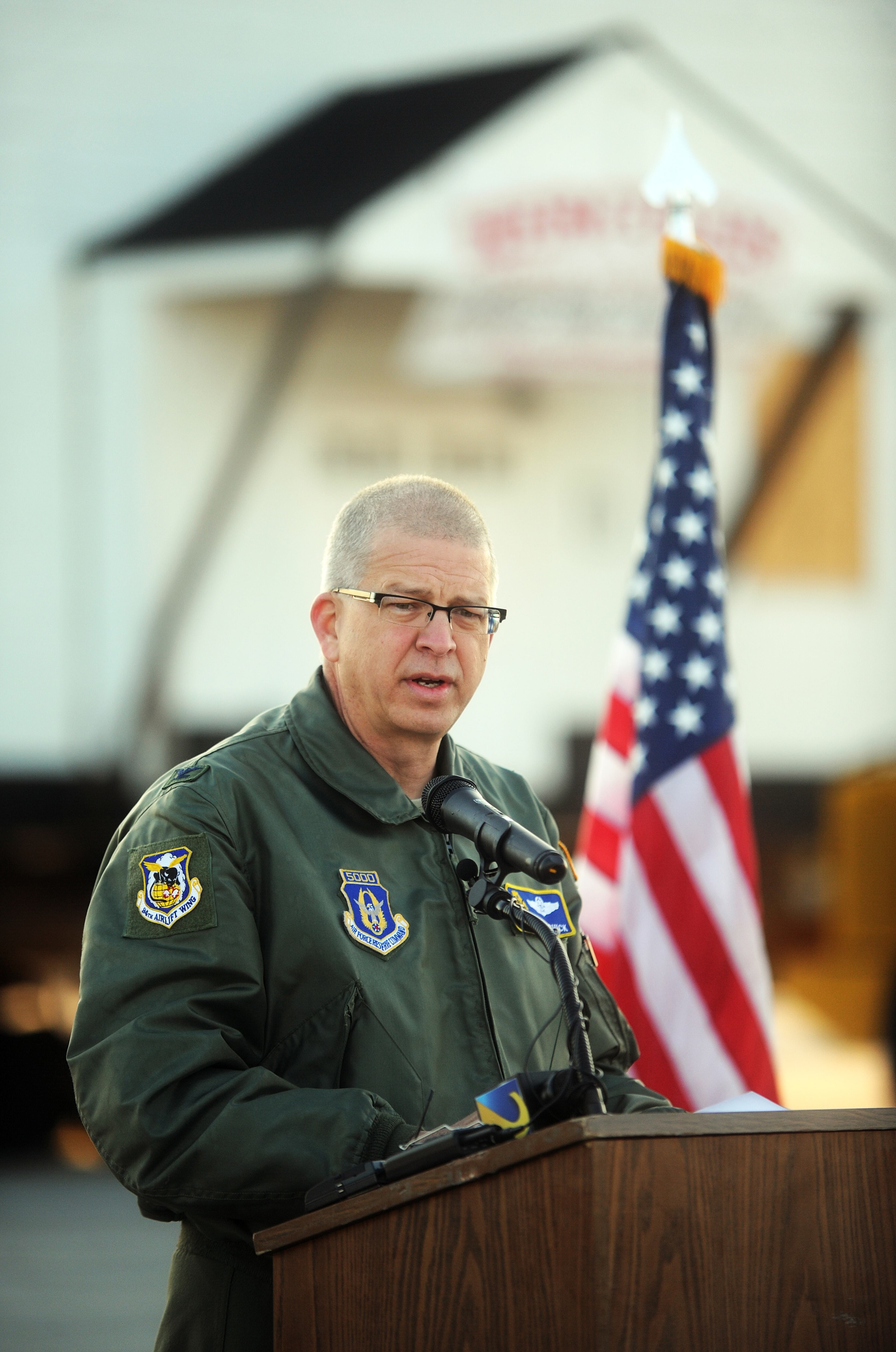 Col. Tim Tarchick, commander of the 94th Airlift Wing at Dobbins Air Reserve Base, speaks during a ceremony before Dobbins Chapel is moved from its former home at Dobbins to its new home at the Clay National Guard Center in Marietta Sunday.
