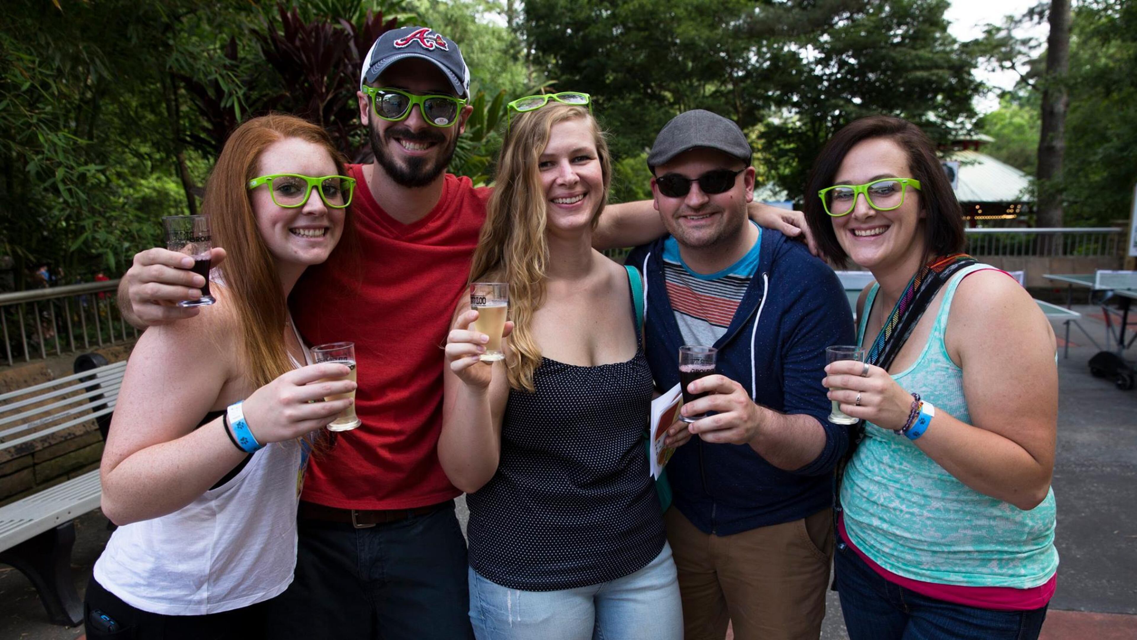Atlantans smile for the camera with their brews at a previous Brew at the Zoo event.