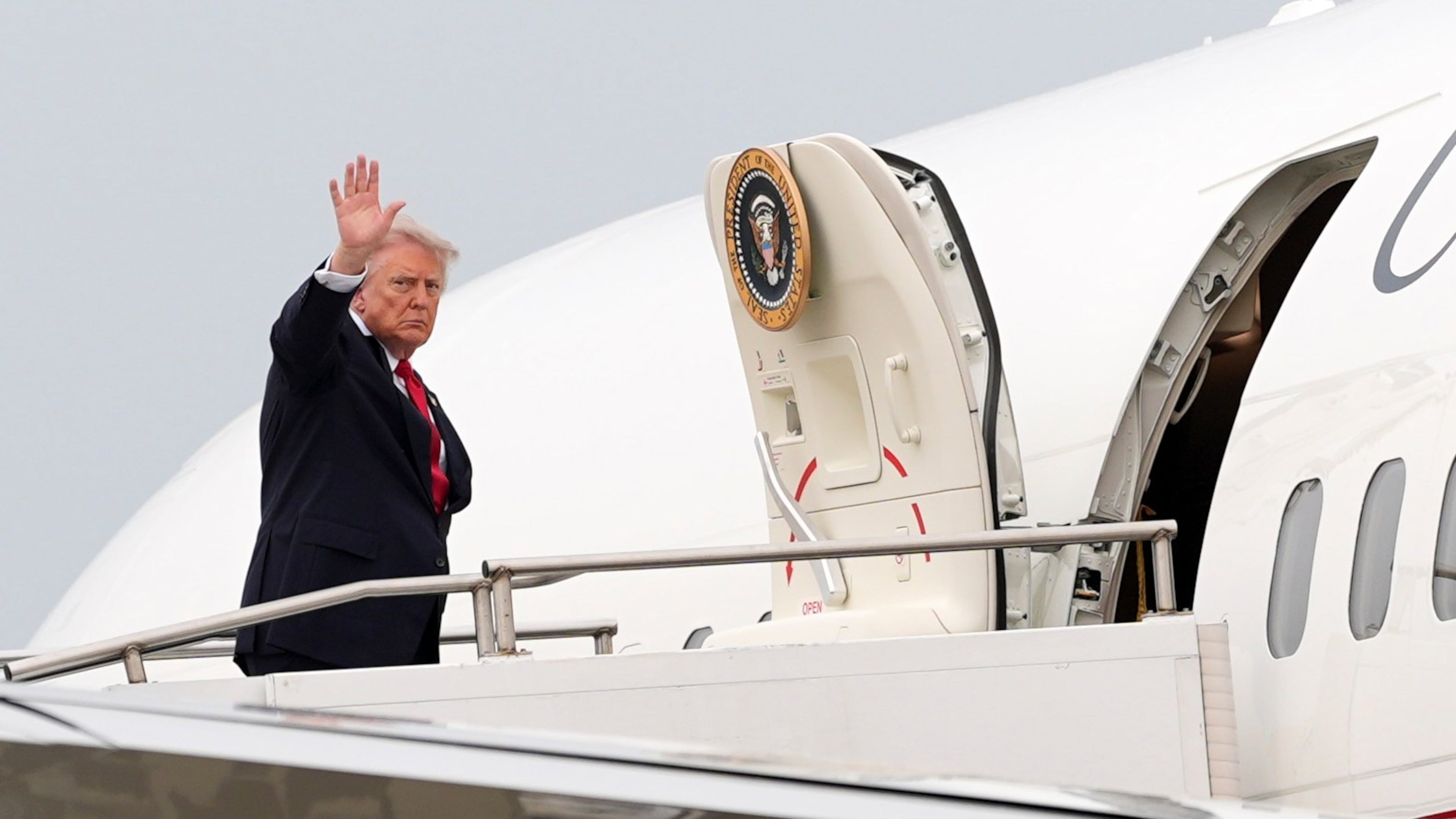 President Donald Trump waves as he departs on Air Force One at Oakland County International Airport, Monday, July 27, 2026, in Waterford Township, Mich. (AP Photo/Alex Brandon)