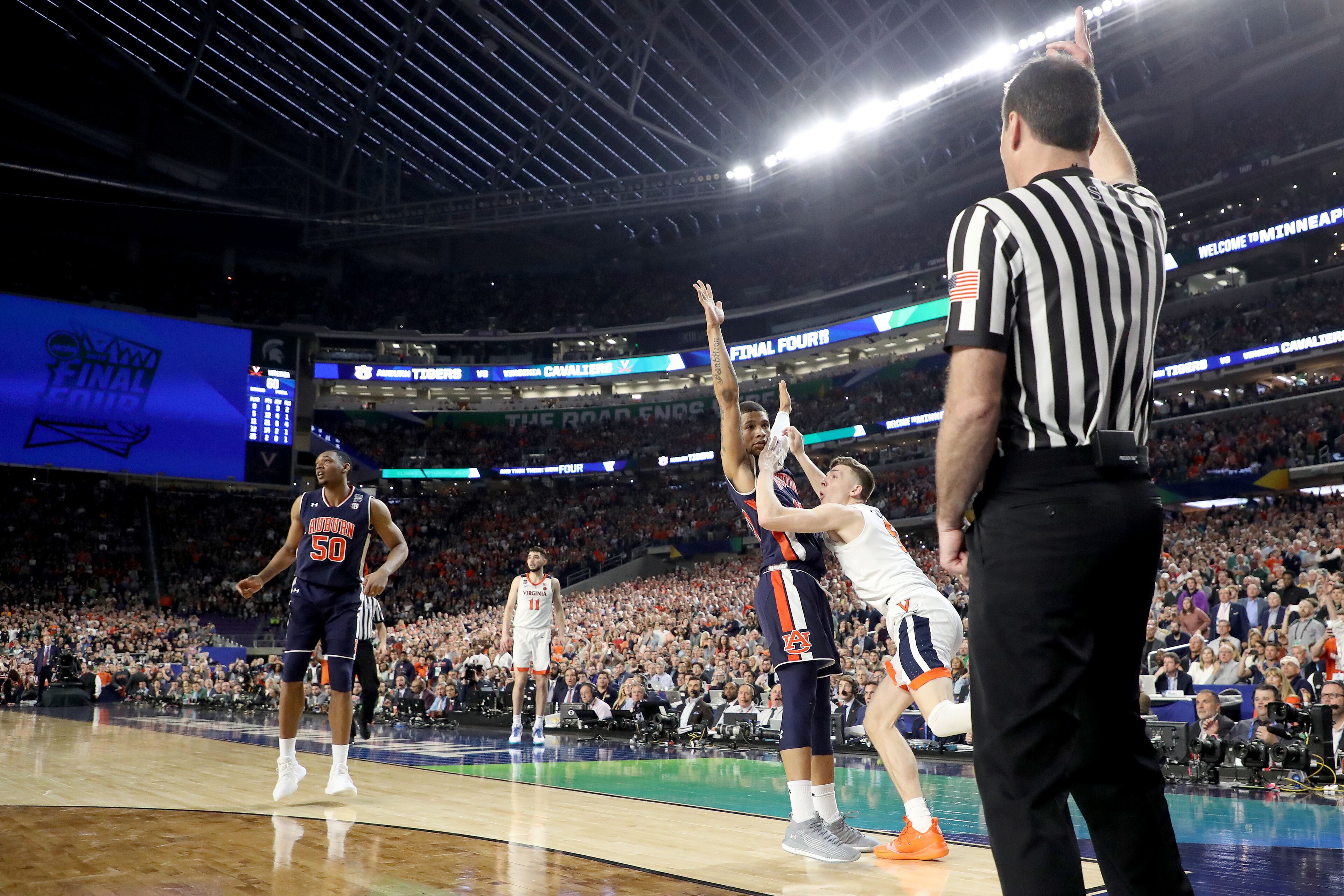 With his team down by two points, Kyle Guy of Virginia attempted a three-pointer as time expired. A foul was called on Auburn's Samir Doughty. Guy made all three free throws and the Cavs advanced to the national championship game. (Photo by Streeter Lecka/Getty Images)