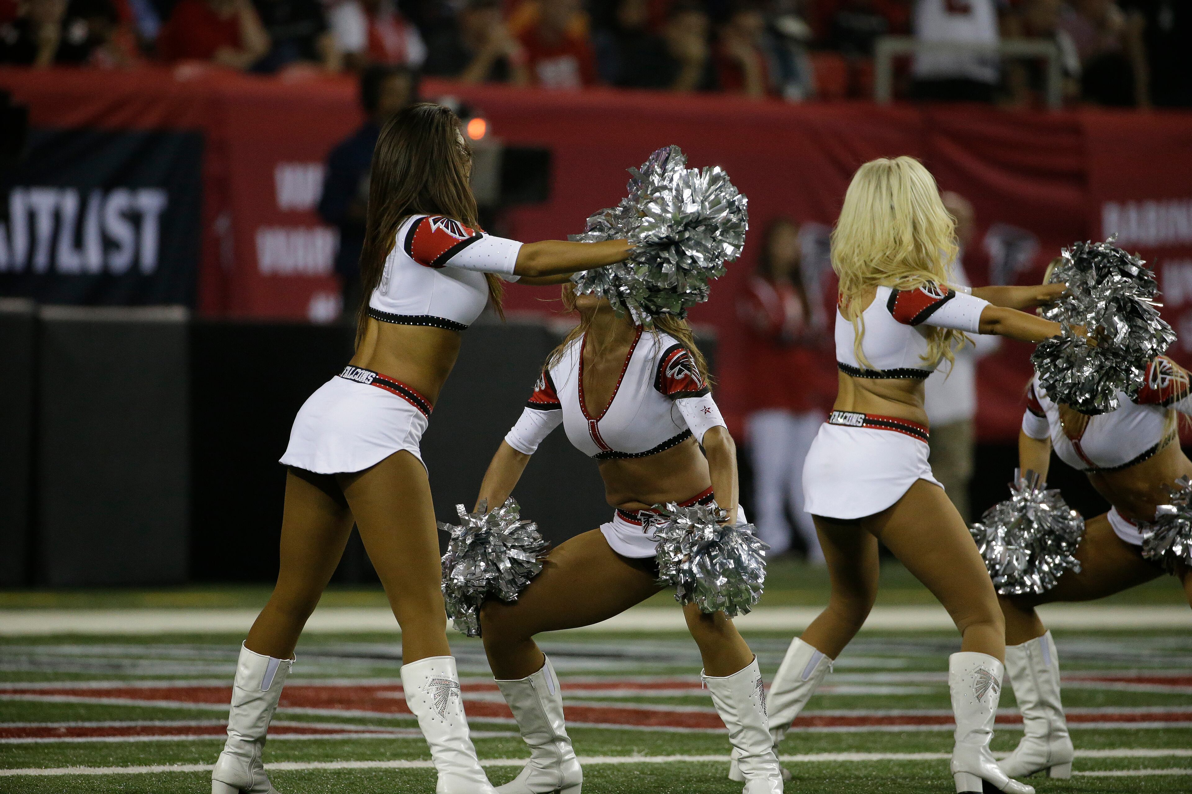 Atlanta Falcons cheerleaders perform during the first half of an NFL football game against the Tampa Bay Buccaneers, Thursday, Sept. 18, 2014, in Atlanta. (AP Photo/David Goldman)