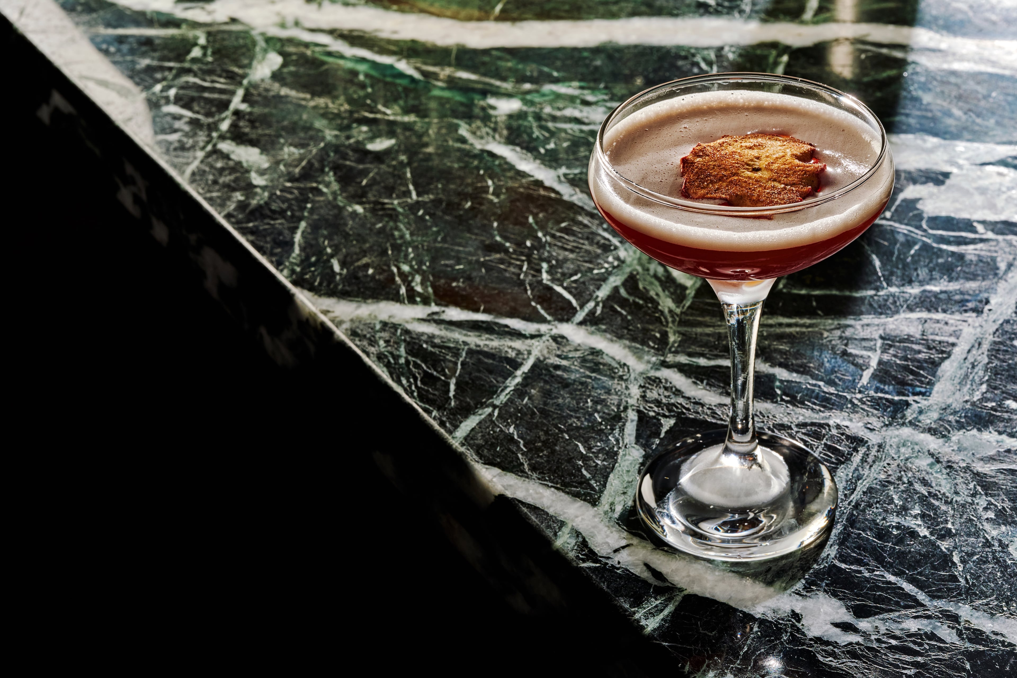The Autumn Breeze cocktail, garnished with a dried apple slice, headlines the new fall menu at Buckhead's the Betty.
(Courtesy of Andrew Thomas Lee)