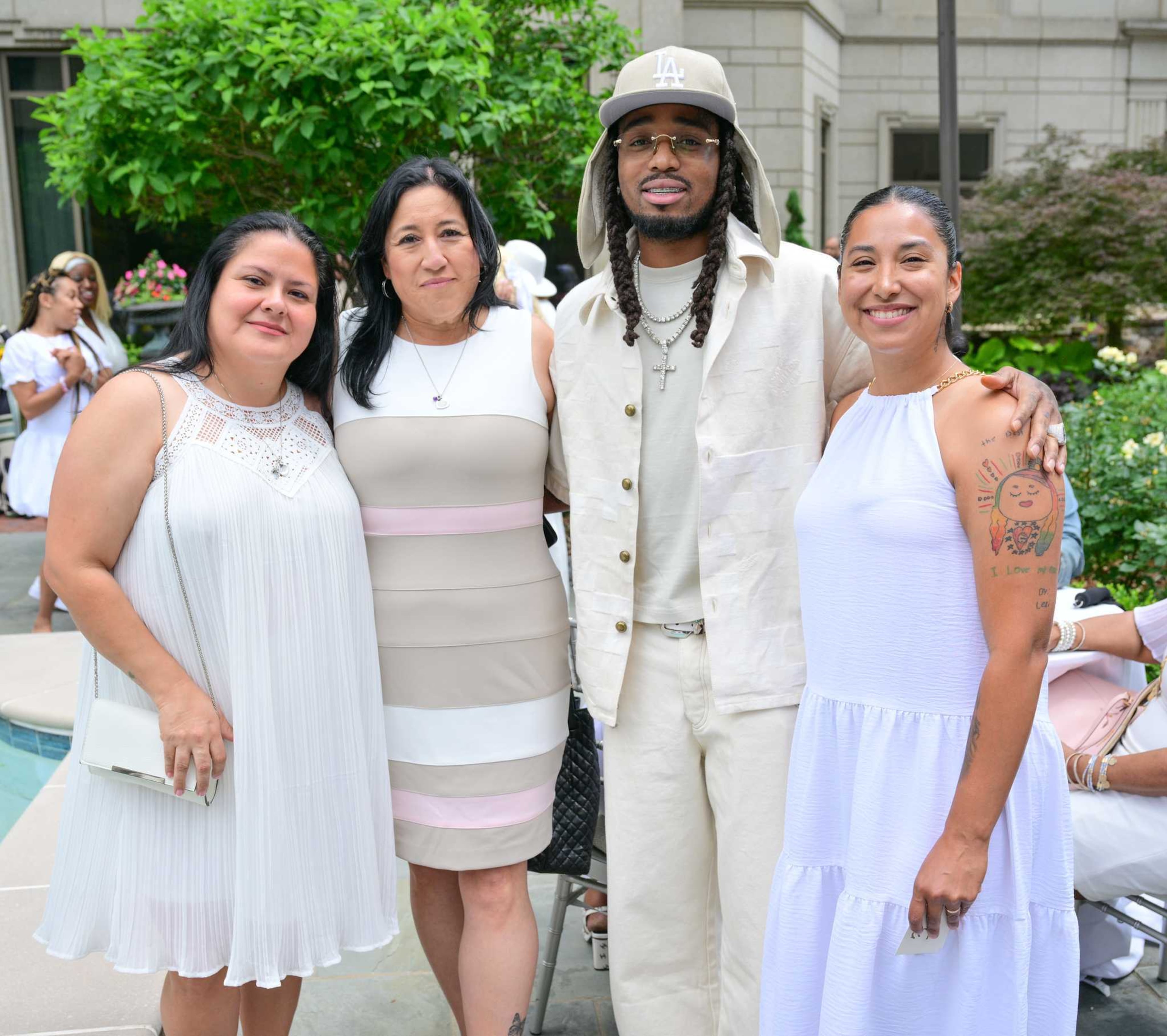 (From left to right): Gloria Cazares, Veronica Mata, Quavo and Kimberly Matta-Rubio pose for a photo at the Rocket Foundation's Bereaved Mother's Day Brunch in Buckhead on May 4, 2025. Cazares, Mata and Mata-Rubio are the leaders of Lives Robbed. Photo credit: Prince Williams/Getty Images