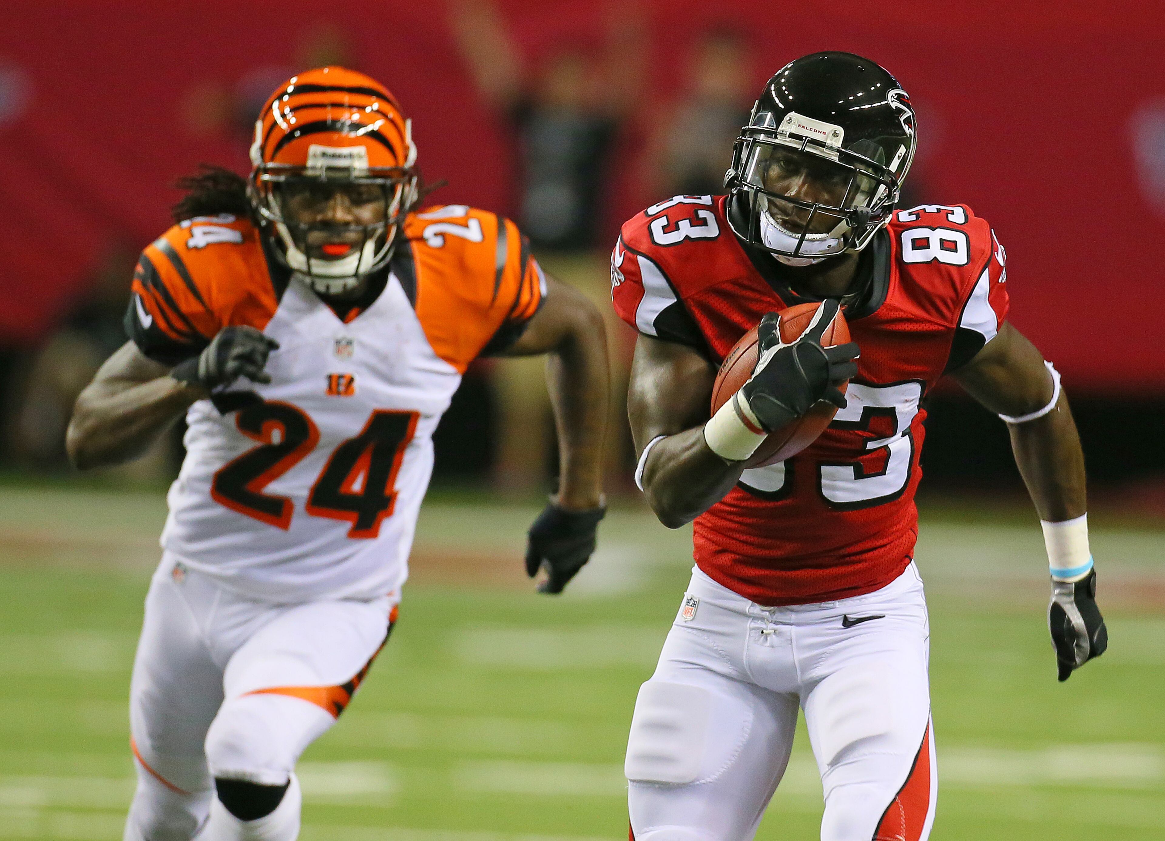 Falcons wide receiver Harry Douglas breaks away from Bengals cornerback Adam Jones for a long gain on the opening drive of their NFL exhibition game on Aug. 8, 2013, in Atlanta. The Falcons settled for a field goal for a 3-0 lead on the drive.