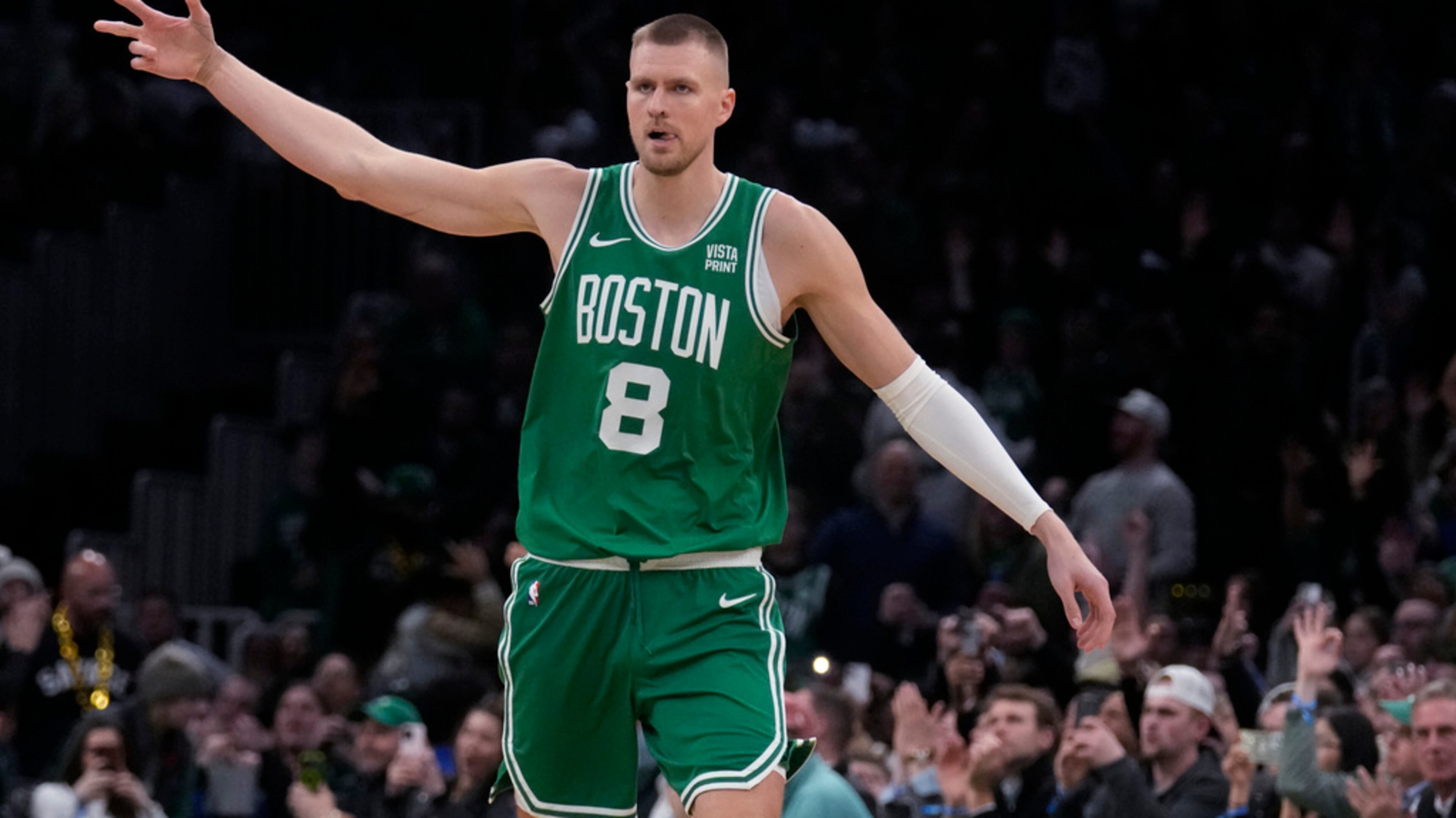 Boston Celtics center Kristaps Porzingis celebrates after hitting a 3-pointer against the Atlanta Hawks during the second half of an NBA basketball game Wednesday, Feb. 7, 2024, in Boston. (Charles Krupa/AP)