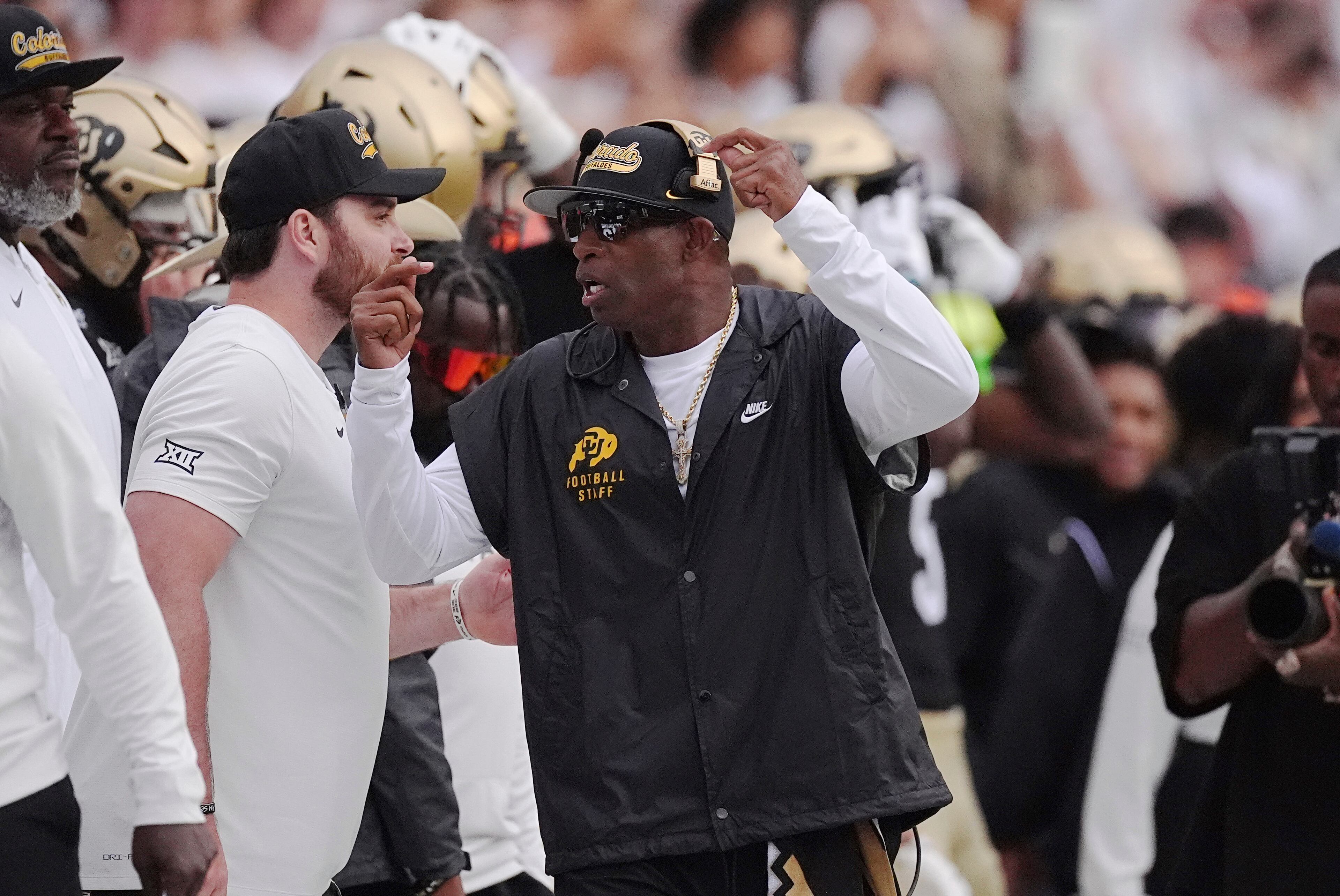 Colorado coach Deion Sanders (center) exhorts his team during the first half against Georgia Tech on Friday, Aug. 29, 2025, in Boulder, Colo. (David Zalubowski/AP)