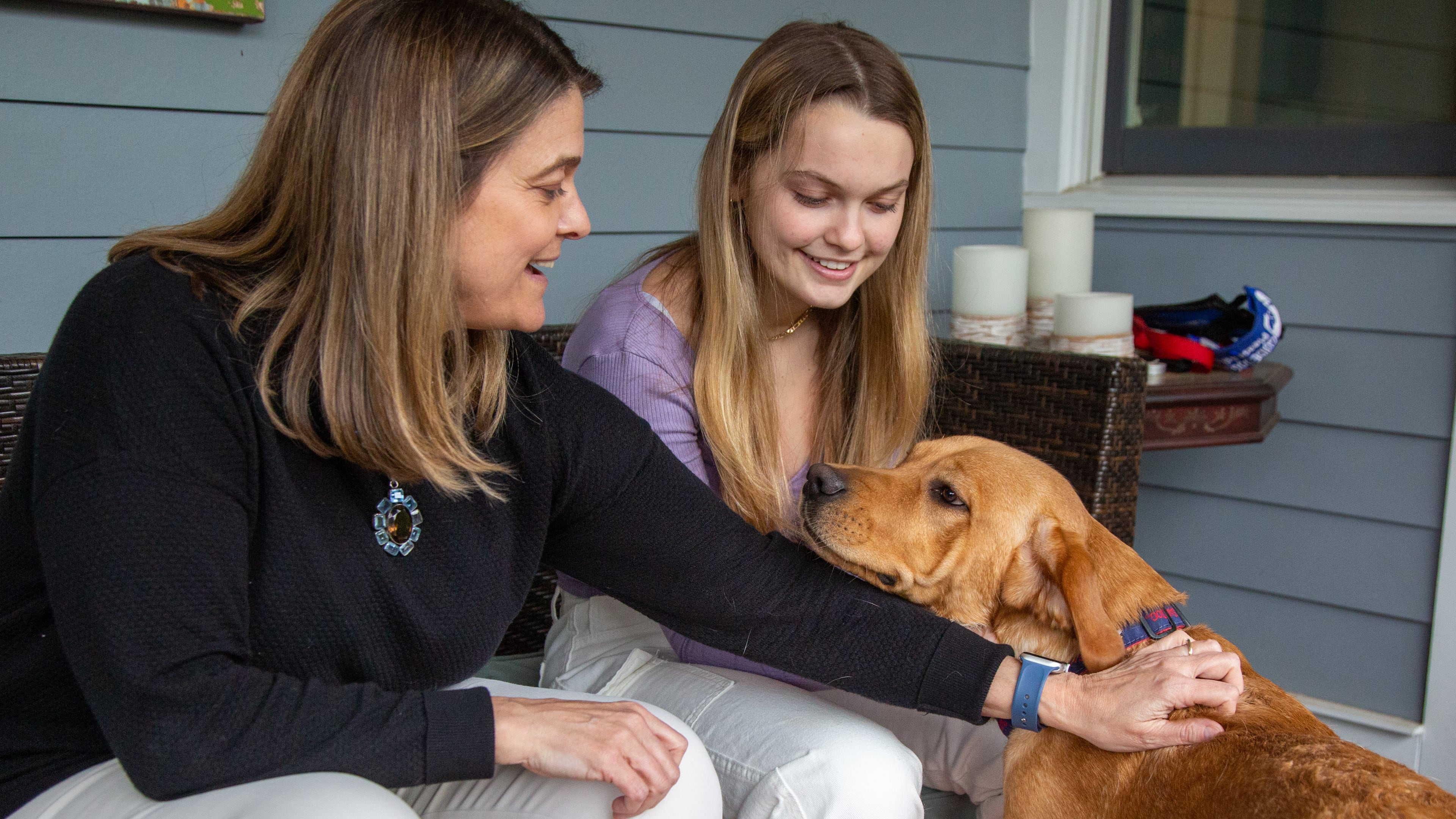 Laurel Kimbrough (left) and her daughter Margaret play with their puppy Chip who they are raising to be a service dog in their Atlanta home. PHIL SKINNER FOR THE ATLANTA JOURNAL-CONSTITUTION.