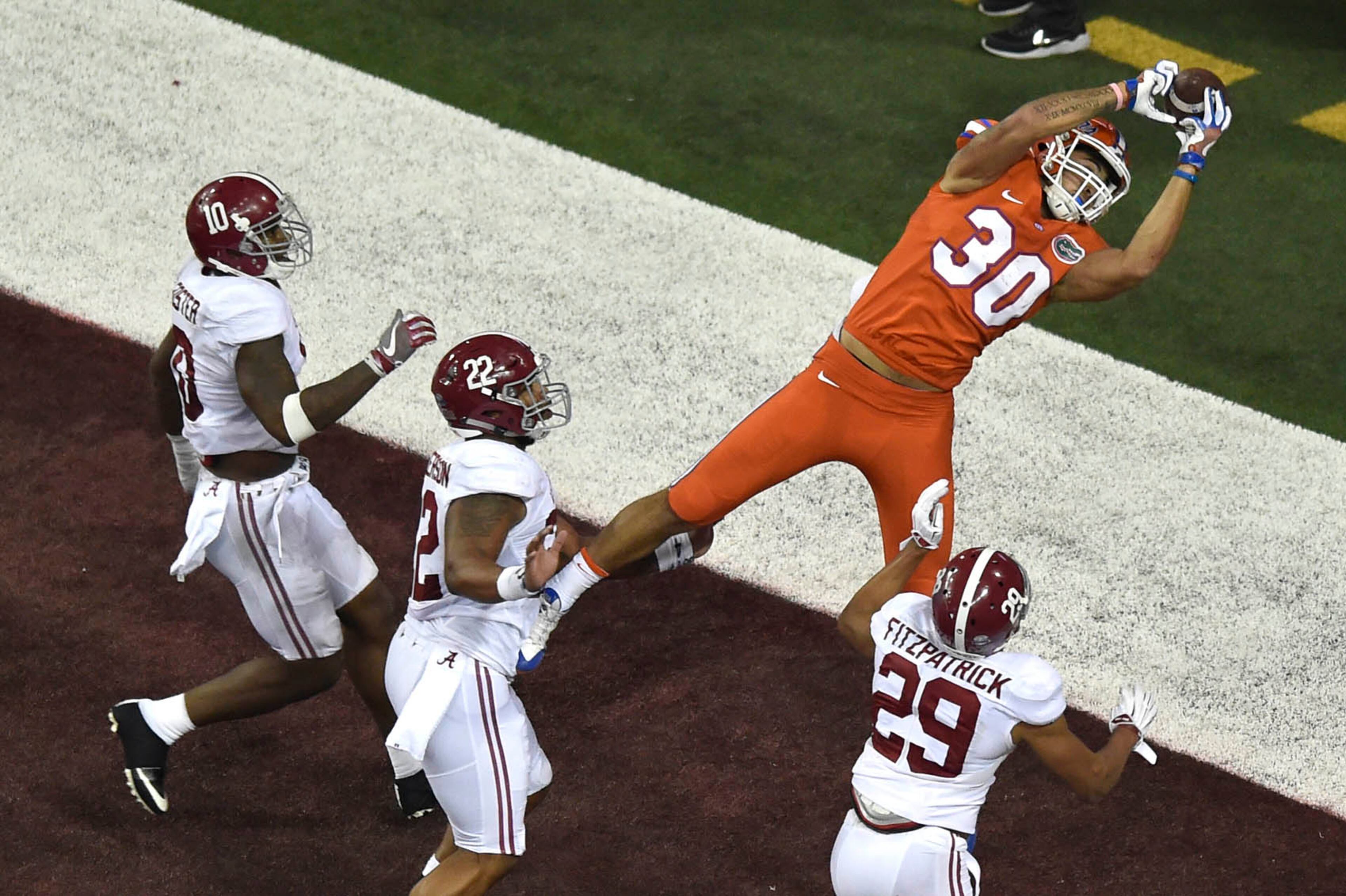 December 3, 2016, Atlanta - Florida tight end DeAndre Goolsby (30) jumps for the ball but fails to keep hold of it during the SEC Championship Game between the Alabama Crimson Tide and the Florida Gators in Atlanta, Georgia, on Saturday, December 3, 2016. (DAVID BARNES / DAVID.BARNES@AJC.COM)