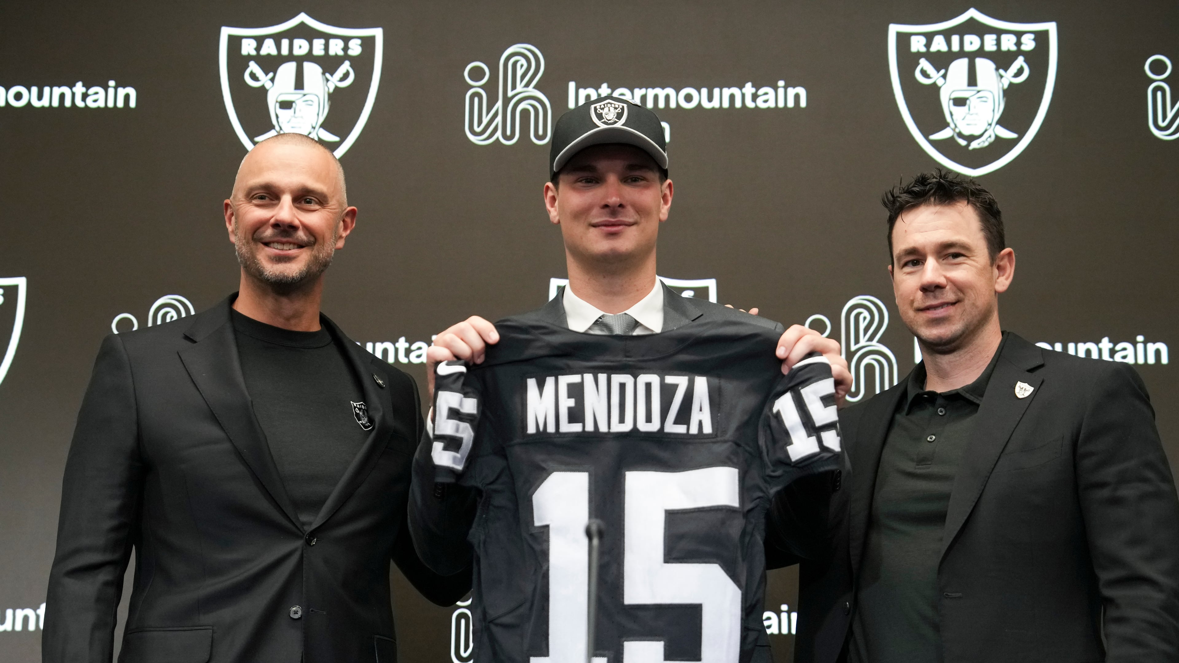 From left to right, Las Vegas Raiders general manager John Spytek, first-round draft pick Fernando Mendoza and head coach Klint Kubiak pose for a photo during an NFL football news conference Friday, April 24, 2026, in Henderson, Nev. (AP Photo/Candice Ward)