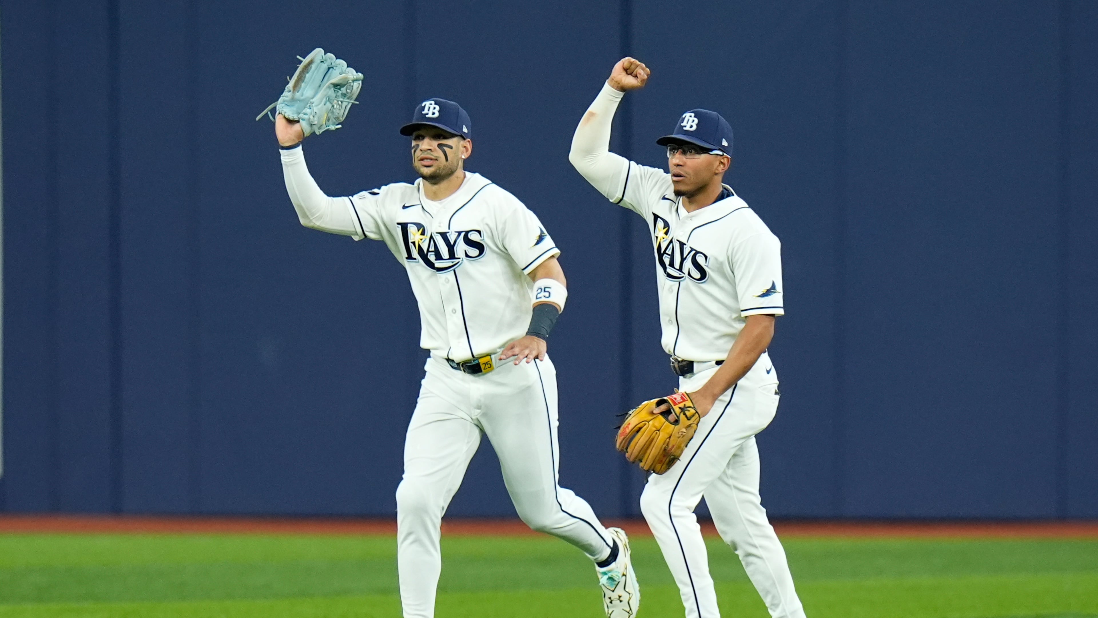 Tampa Bay Rays right fielder Victor Mesa Jr., left, and Rays second baseman Richie Palacios, right, react after Mesa Jr. caught a fly ball hit by New York Yankees' Spencer Jones that hit the ceiling of Tropicana Field for an out during the second inning in Game 2 of an American League Division Series baseball game Monday, Oct. 5, 2026, in St. Petersburg, Fla. (AP Photo/Chris O'Meara)