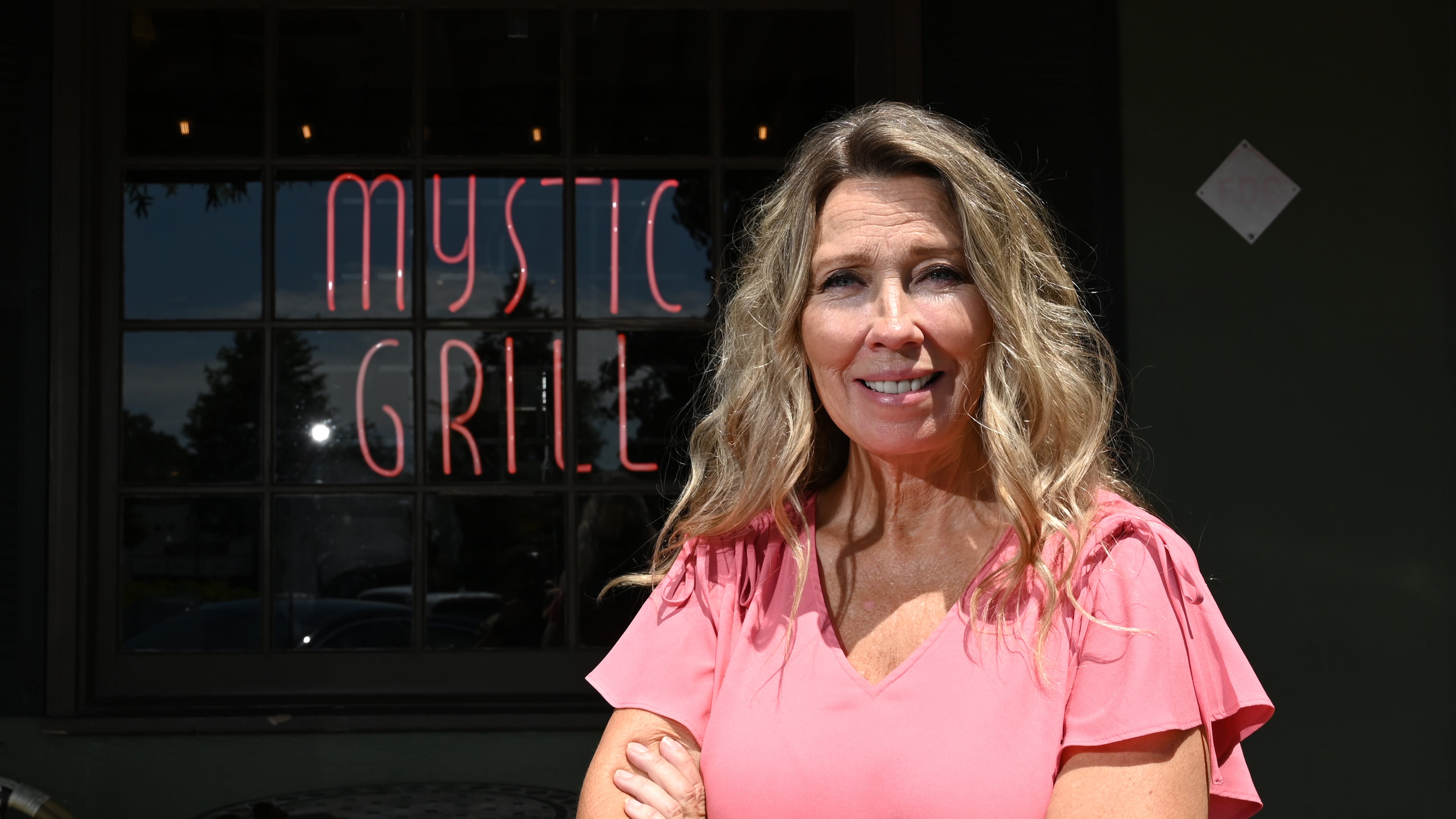 Angi Henderson, owner of the Mystic Grill, poses for a photo outside her restaurant in Covington. The city's business leaders and residents are putting together a fan appreciation weekend for "Vampire Diaries" fans who are out thousands of dollars after a convention company canceled an event there in November. (Hyosub Shin/AJC)