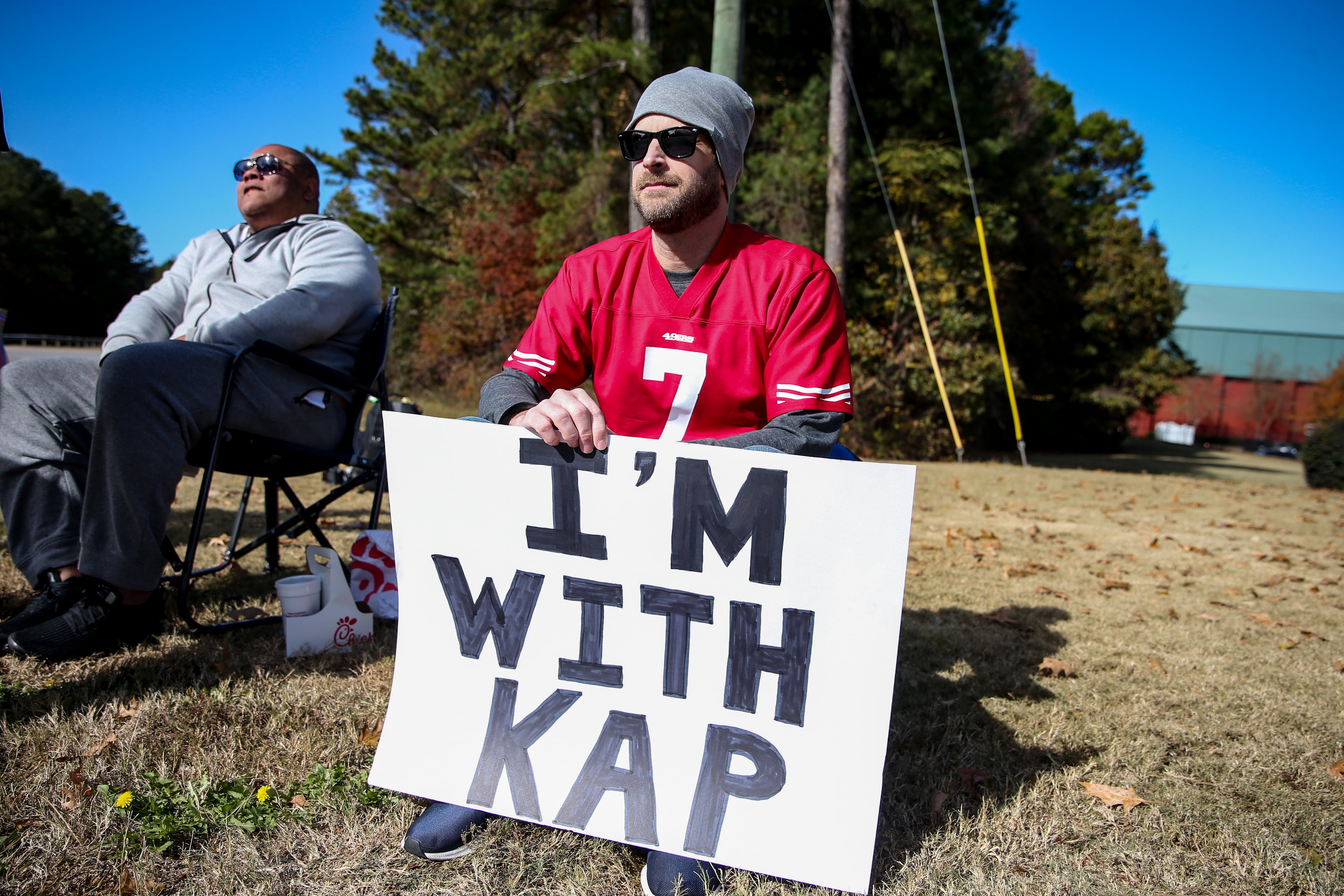 FLOWERY BRANCH, GA - NOVEMBER 16: A man waits outside of the training facility where the Colin Kaepernick private NFL workout is being held on November 16, 2019 in Flowery Branch, Georgia. (Photo by Carmen Mandato/Getty Images)
