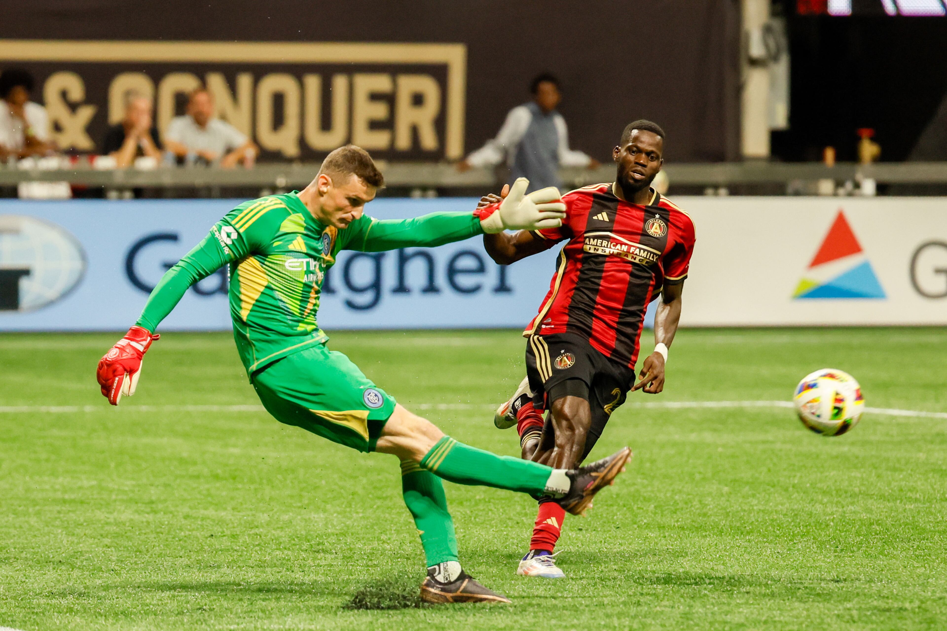 New York City goalkeeper Matt Freese (49) kicks the ball under pressure from Atlanta United forward Jamal Thiaré (29) during the second half at Mercedes-Benz Stadium on Wednesday, July 17, 2024.
(Miguel Martinez/ AJC)