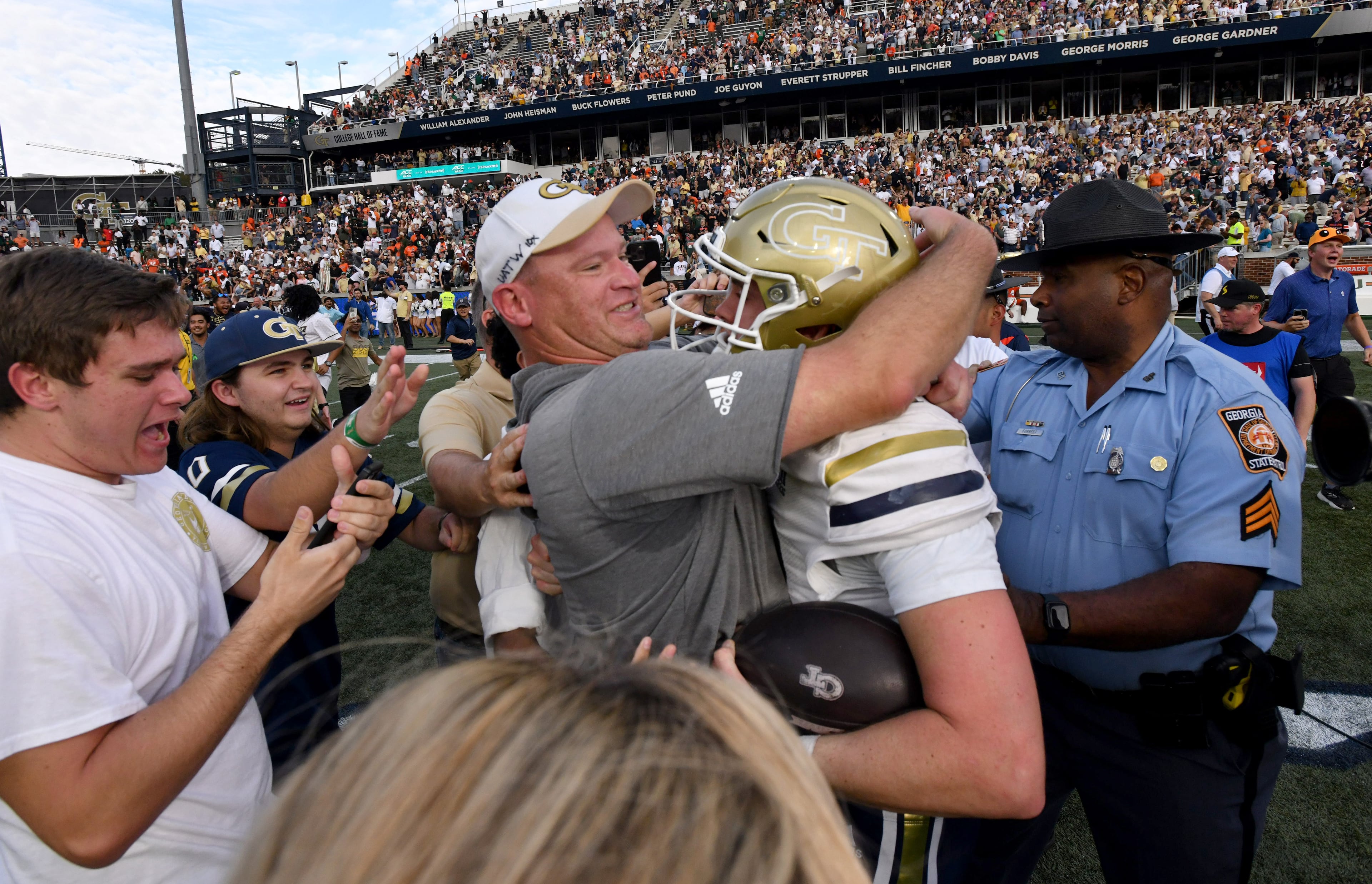 Georgia Tech head coach Brent Key and quarterback Haynes King (10) celebrate after defeating Miami in an NCAA college football game at Georgia Tech's Bobby Dodd Stadium, Saturday, November 9, 2024, in Atlanta. Georgia Tech won 28-23 over Miami. (Hyosub Shin / AJC)