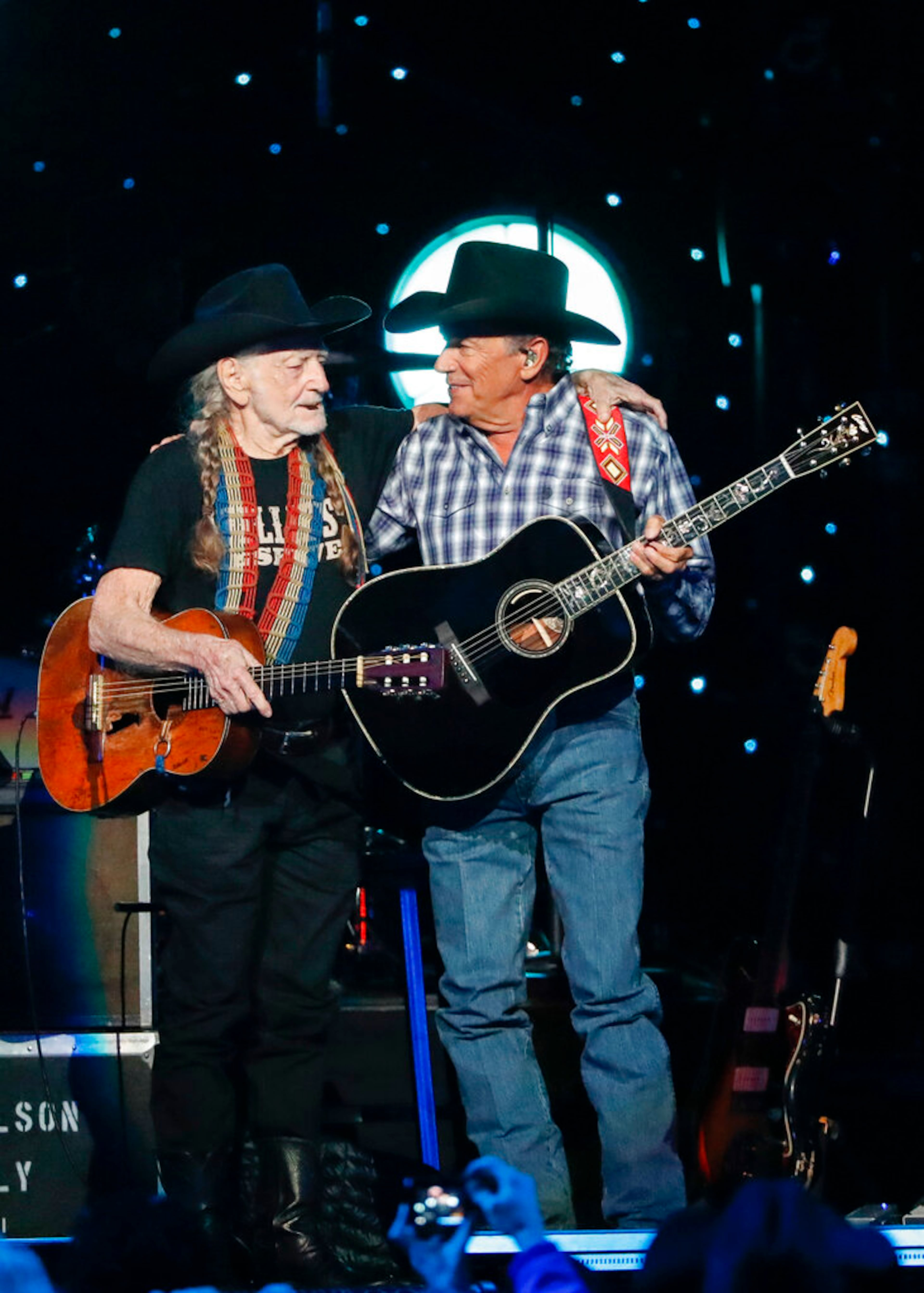 Willie Nelson, left, and George Strait perform at Willie: Life & Songs Of An American Outlaw at Bridgestone Arena on Saturday, Jan. 12, 2019, in Nashville, Tenn. (Photo by Al Wagner/Invision/AP)
