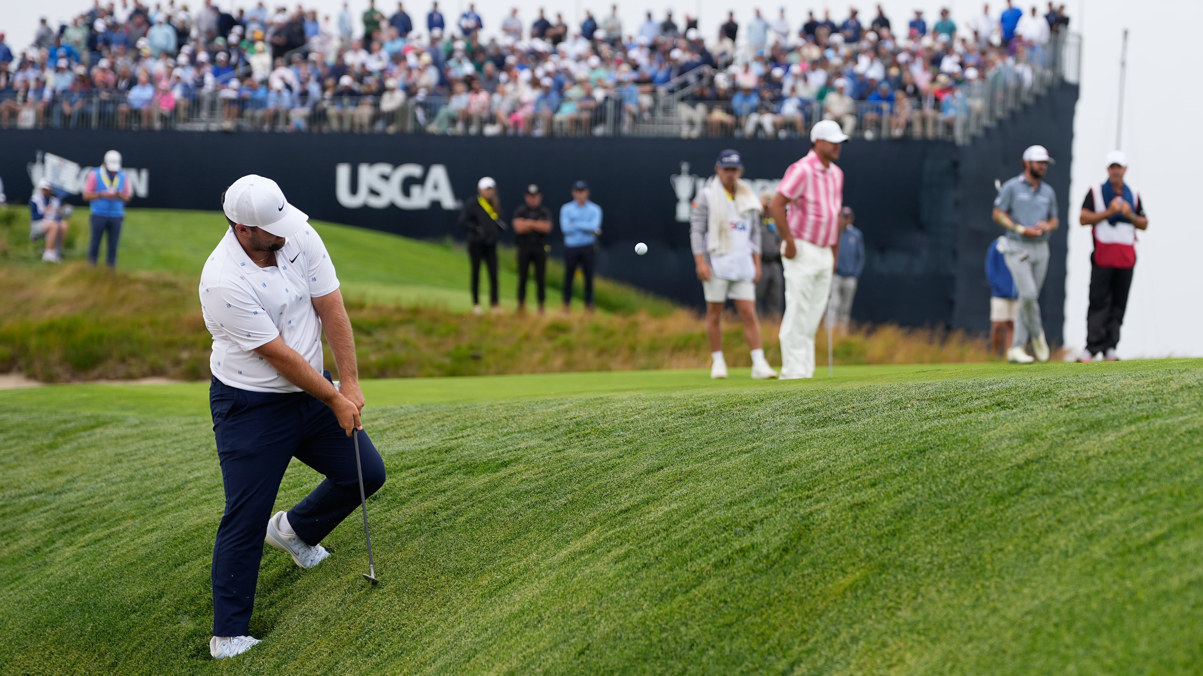 Chris Gotterup chips to the green on the 11th hole during the first round of the U.S. Open golf tournament at Shinnecock Hills Golf Club in Southampton, N.Y., Thursday, June 18, 2026.(AP Photo/George Walker IV)