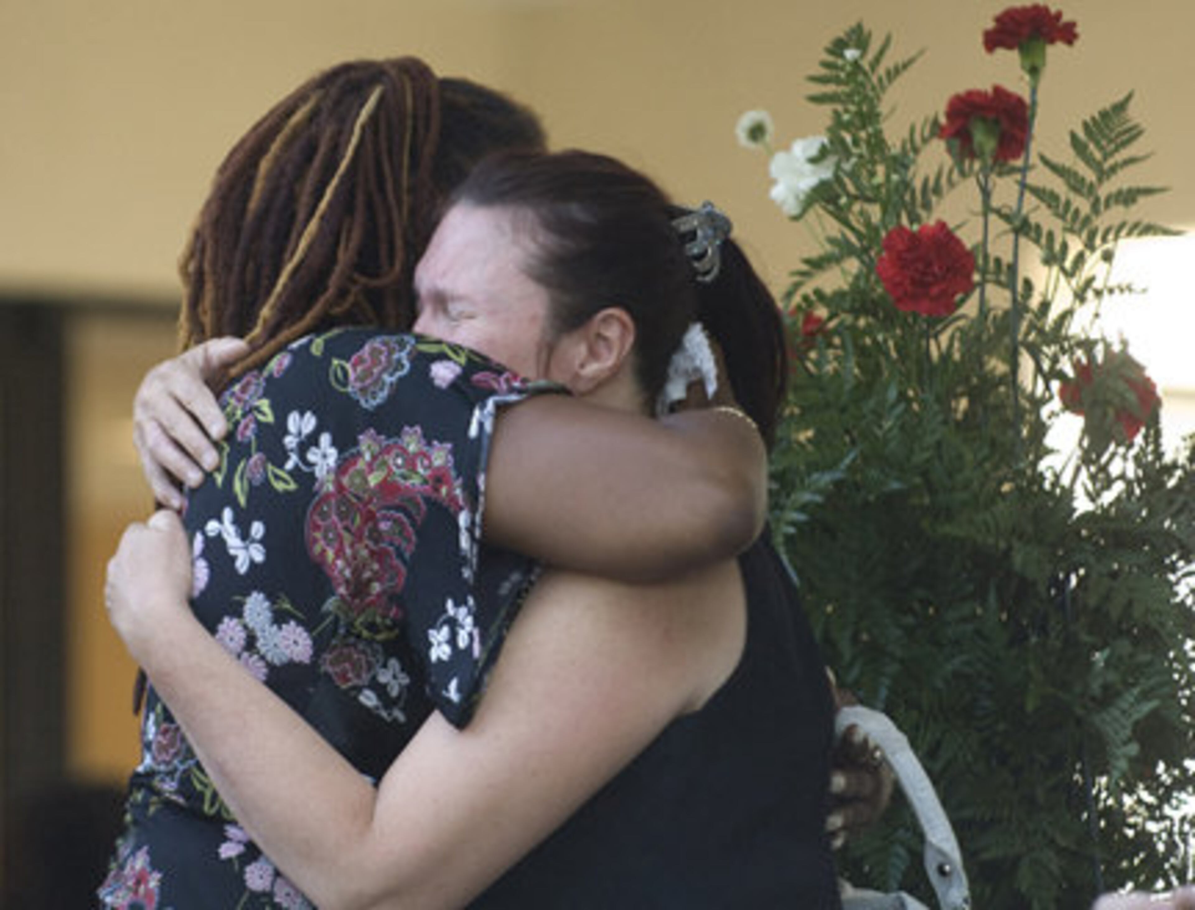 Mourners embrace each other after the funeral of musical great Bo Diddley in Gainesville, Fla. Saturday. Bo Diddley died June 2 of congestive heart failure.