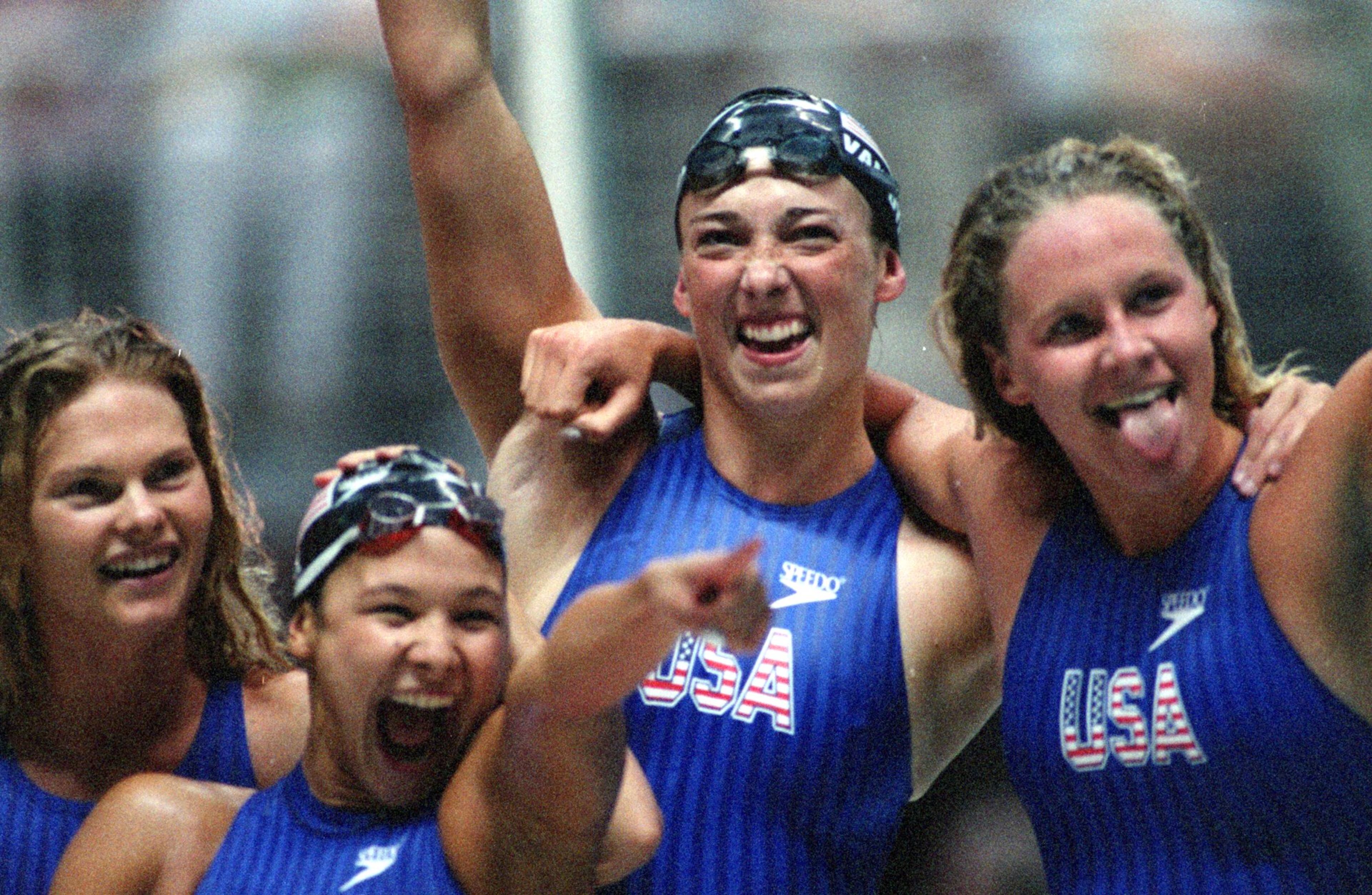 The USA women's freestyle team of (left to right) Angel Martino, Catharine Fox, Amy Van Dyke and Jenny Thompson celebrates their win in the 400-meter event in the 1996 Olympics at the Georgia Tech Aquatic Center. (AJC Staff Photo/Jonathan Newton)