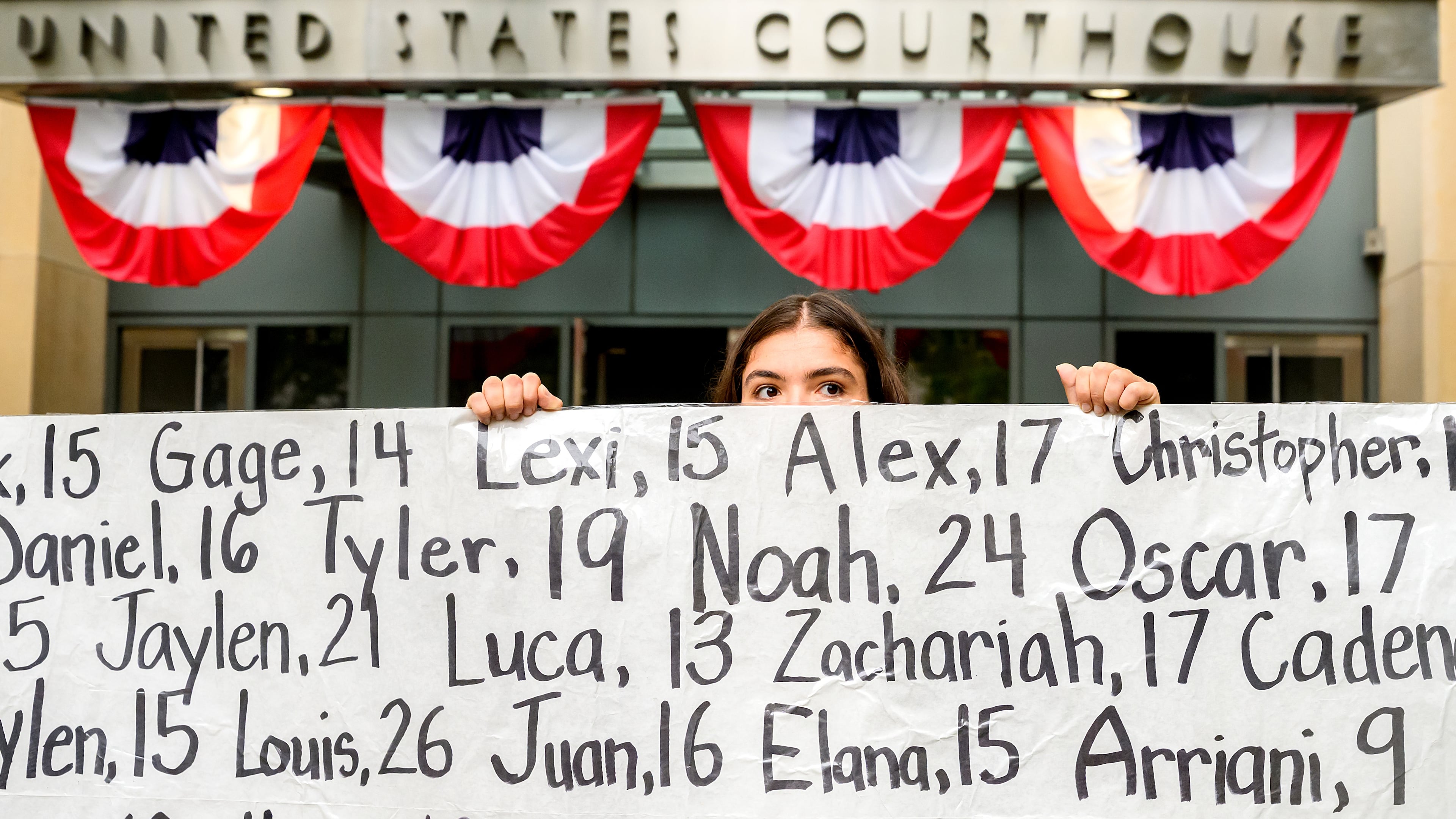 Olivia Konar holds a banner with names of young people who advocates say died as a result of social media outside the Ronald V. Dellums Federal Building and U.S. Courthouse on Tuesday, Aug. 18, 2026, in Oakland, Calif. Her sister Coco Konar died in 2022 when she was 17. (AP Photo/Noah Berger)