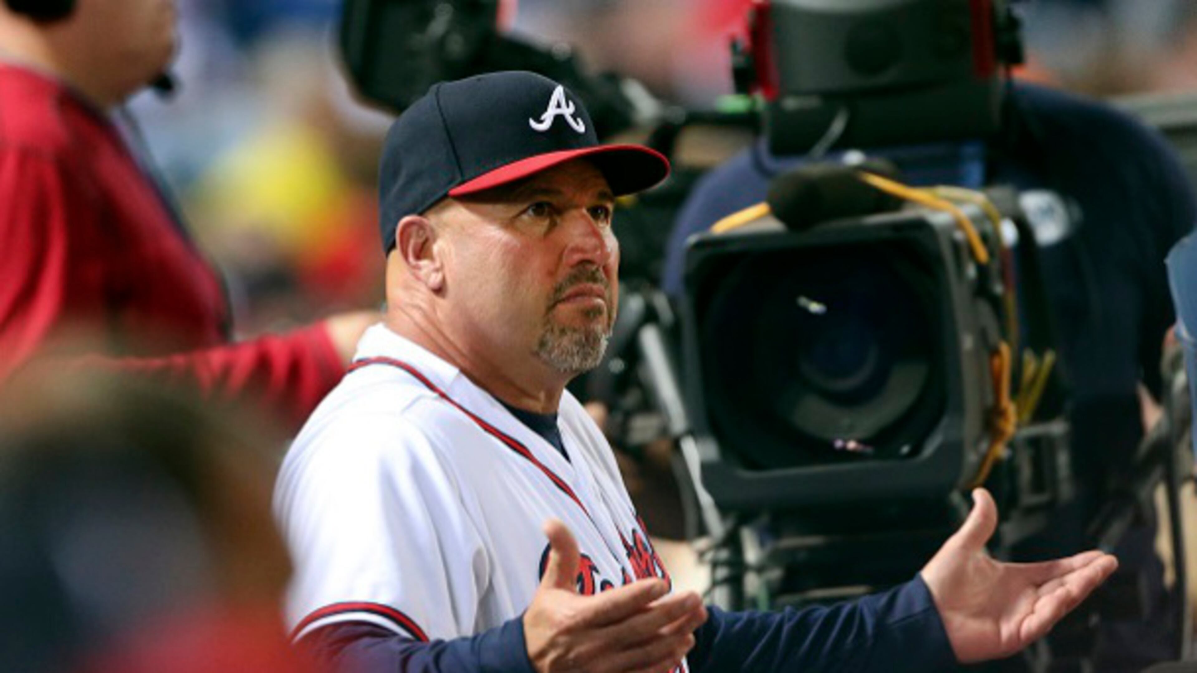 Atlanta Braves manager Fredi Gonzalez (33) argues from the dugout during a baseball game Toronto Blue Jays Wednesday, Sept. 16, 2015, in Atlanta. (AP Photo/John Bazemore)