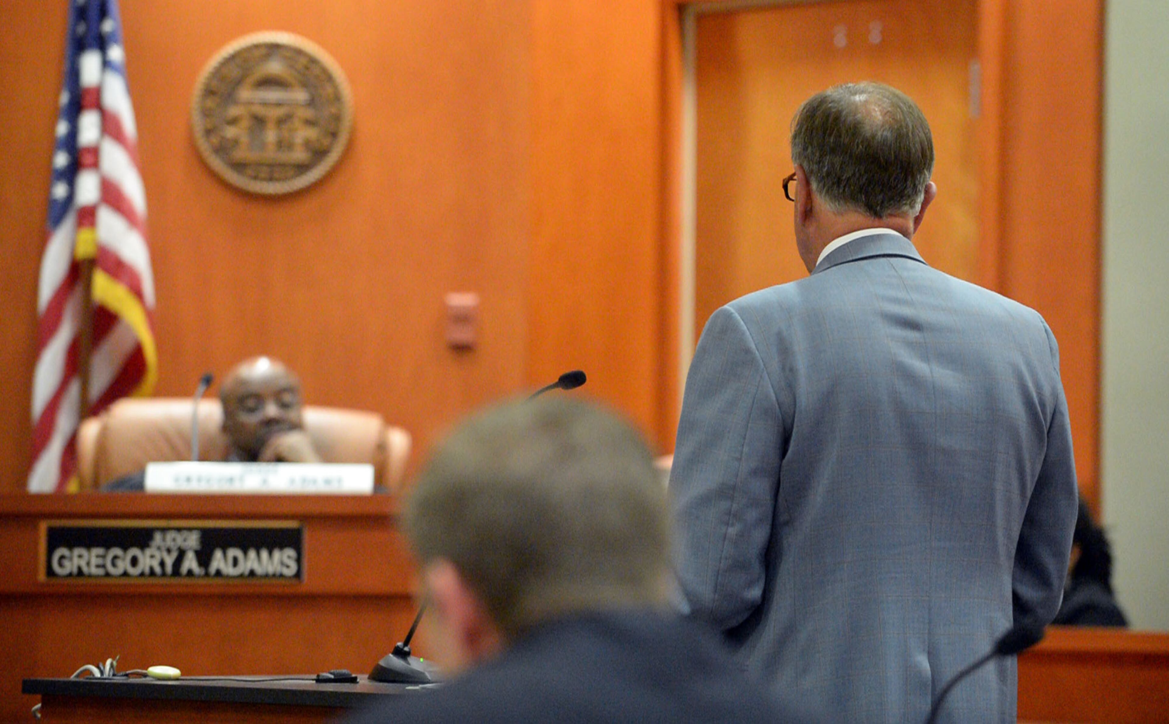 Defense attorney J. Tom Morgan presents a motion before the court Tuesday. DeKalb County Superior Court Judge Gregory A. Adams presides over a motions hearing for Pat Reid and Tony Pope in their convoluted racketeering case, Tuesday, May 12, 2015. KENT D. JOHNSON /KDJOHNSON@AJC.COM