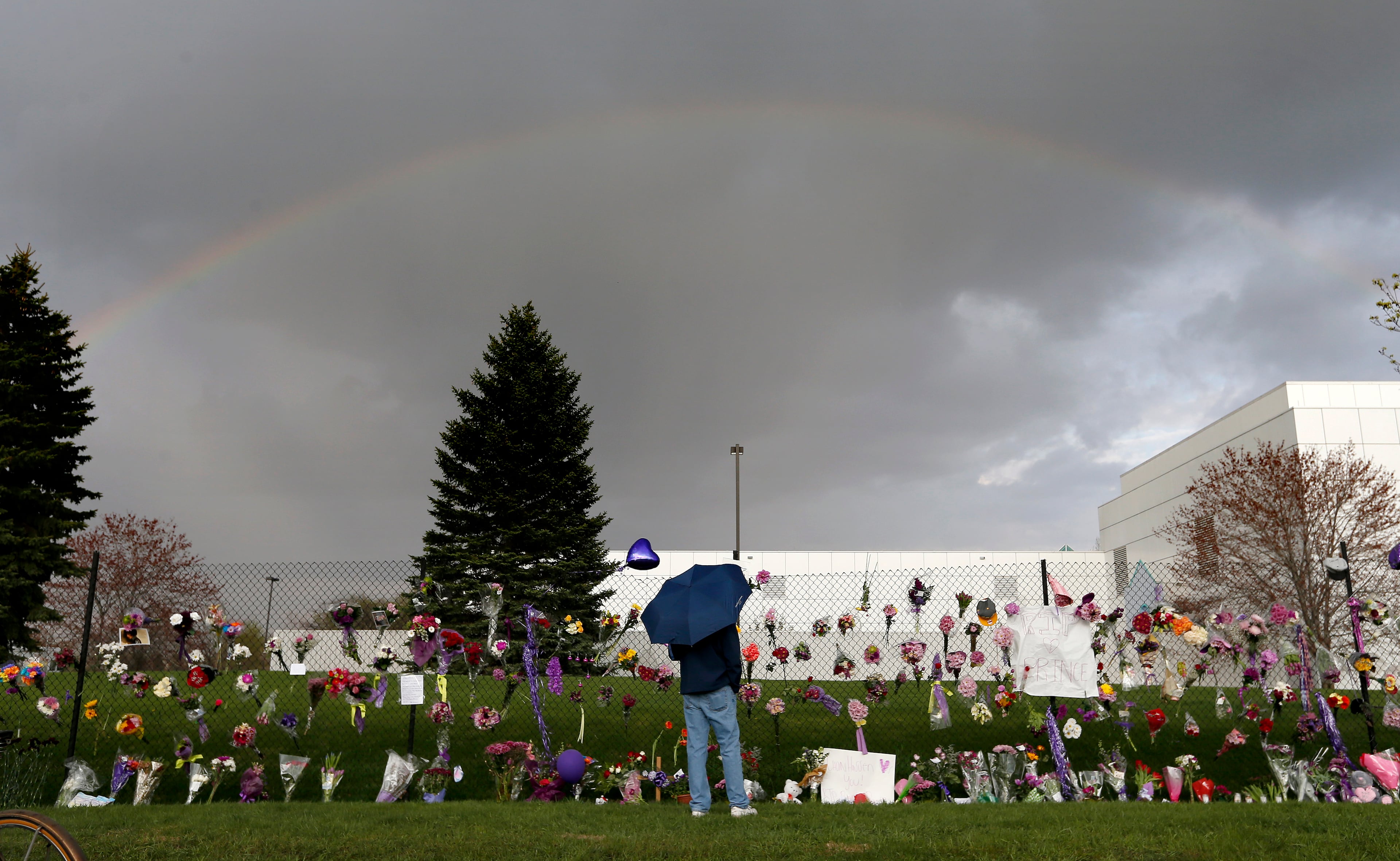 A rainbow appears over Paisley Park near a memorial for Prince, Thursday, April 21, 2016, in Chanhassen, Minn. Prince, widely acclaimed as one of the most inventive and influential musicians of his era with hits including "Little Red Corvette," ''Let's Go Crazy" and "When Doves Cry," was found dead at his home at Paisley Park on Thursday, according to his publicist. He was 57. (Carlos Gonzalez/Star Tribune via AP)
