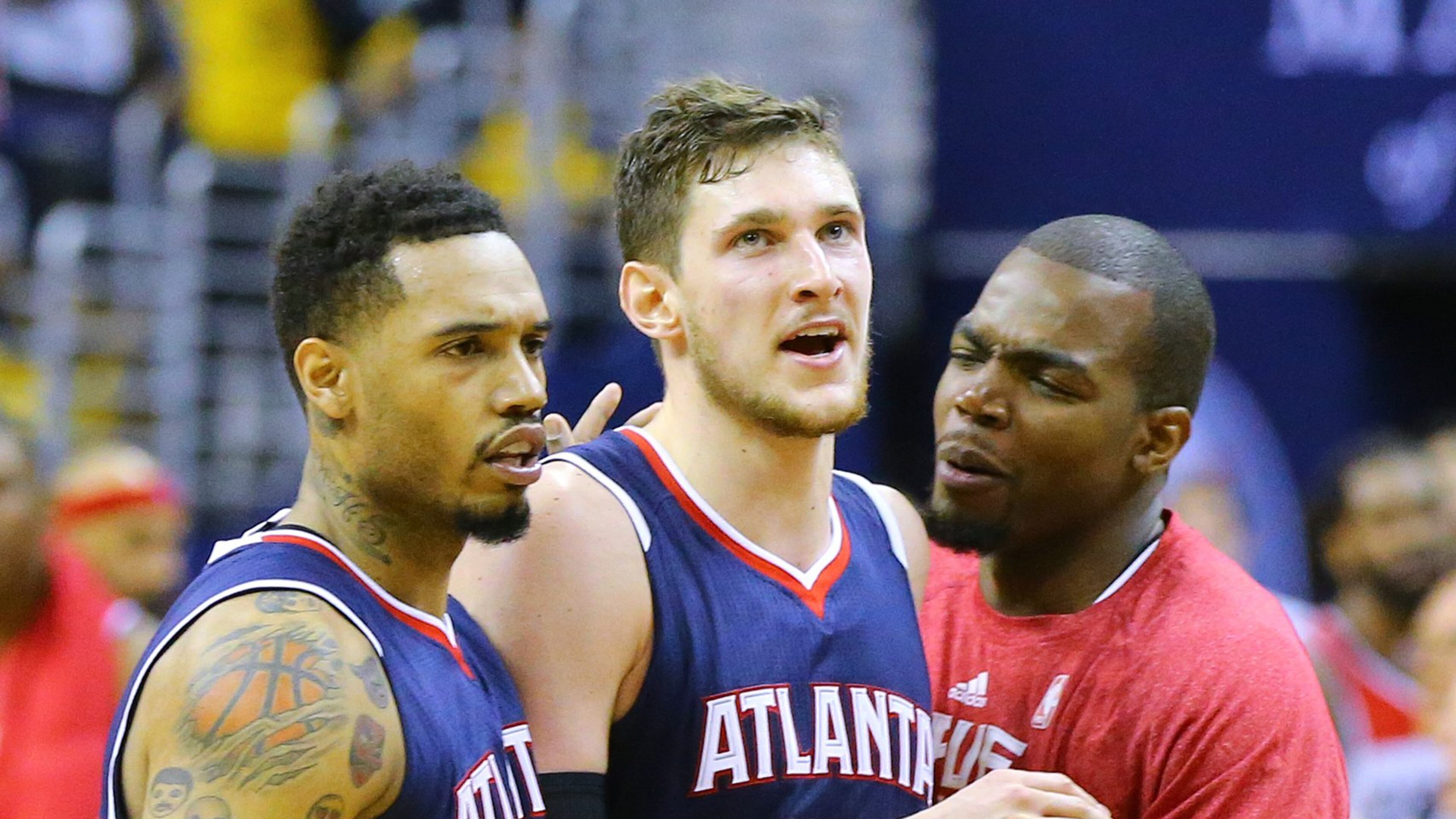 Hawks Mike Muscala (center) gets a pat on the back from Mike Scott and Paul Millsap after tieing the game with the Wizards at 101-101 in the final seconds of their Eastern Conference Semifinals game 3 at the Verizon Center on Saturday, May 9, 2015, in Washington, D.C. Curtis Compton / ccompton@ajc.com