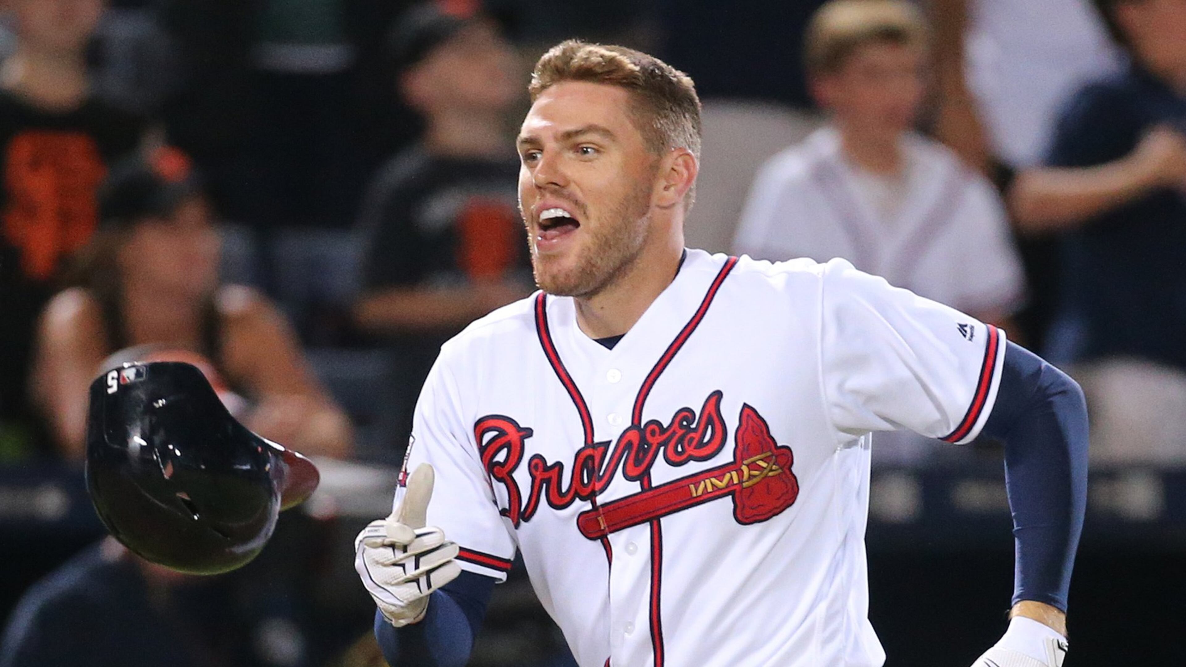 Freddie Freeman reacts after hitting a walk-off home run in the eleventh inning for a June 1 win against San Francisco at Turner Field. (Curtis Compton/AJC file photo)