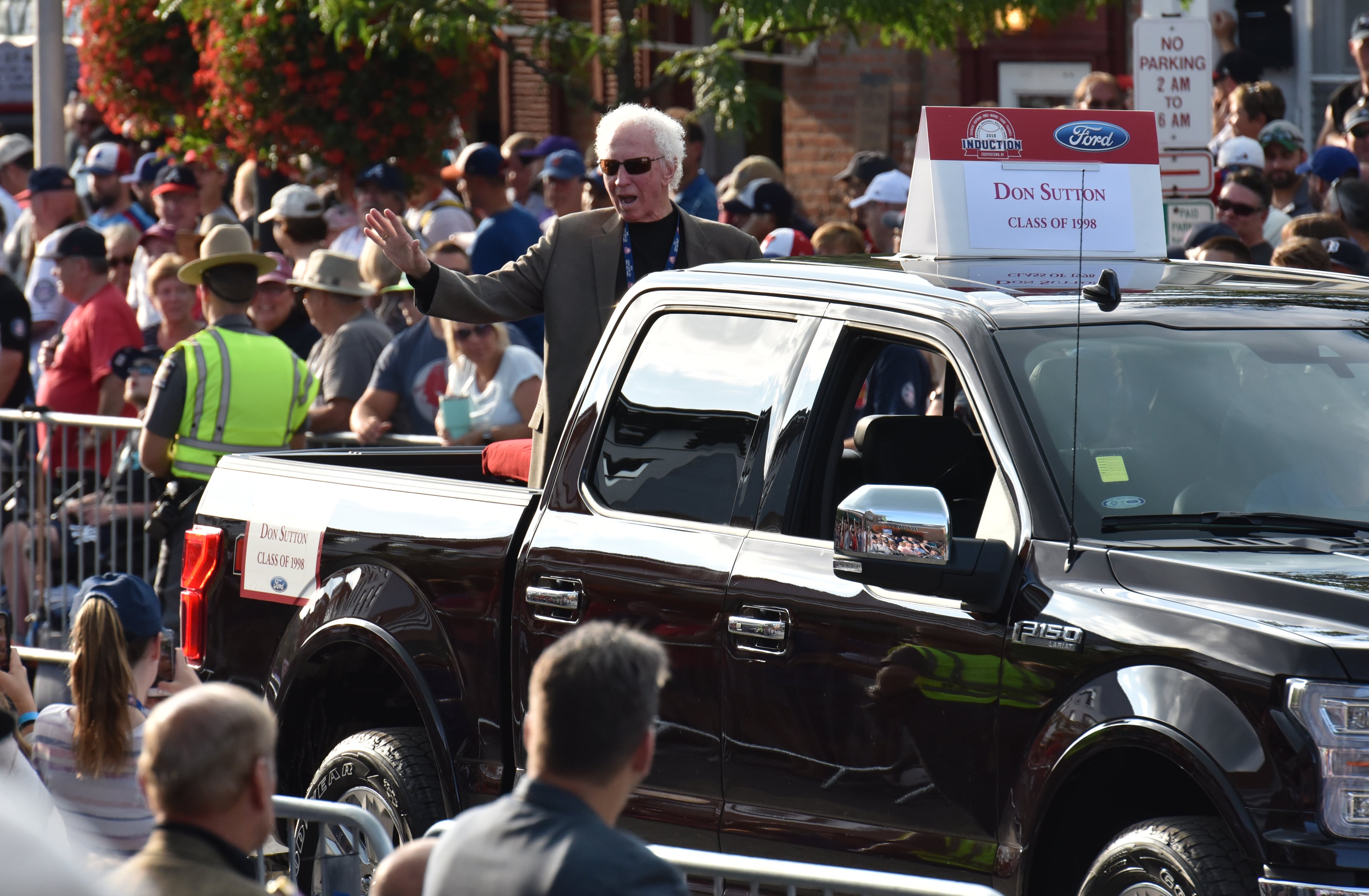 July 28, 2018 Cooperstown, N.Y. - National Baseball Hall of Fame member Don Sutton waves to spectators from the back of a pickup truck during Hall of Fame Legends Parade in Cooperstown, N.Y. on Saturday, July 28, 2018. Braves legend Chipper Jones is set for induction into the National Baseball Hall of Fame on Sunday in Cooperstown, N.Y. HYOSUB SHIN / HSHIN@AJC.COM