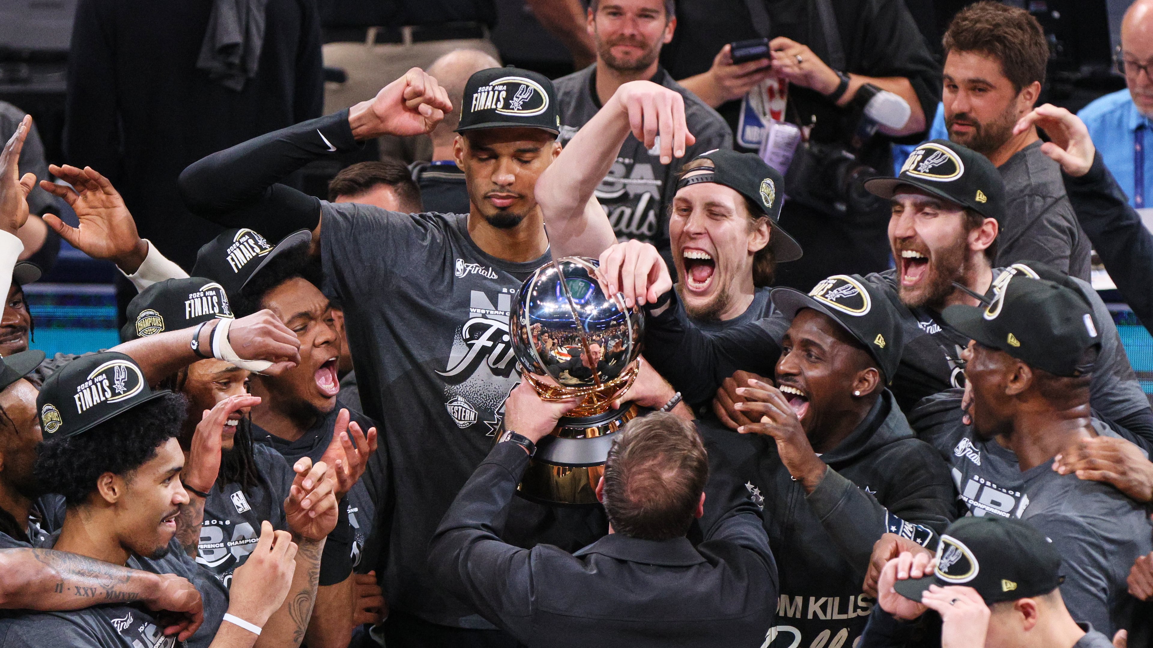 The San Antonio Spurs celebrate after defeating the Oklahoma City Thunder in the Western Conference finals of the NBA basketball playoffs series Saturday, May 30, 2026, in Oklahoma City. (AP Photo/Nate Billings)
