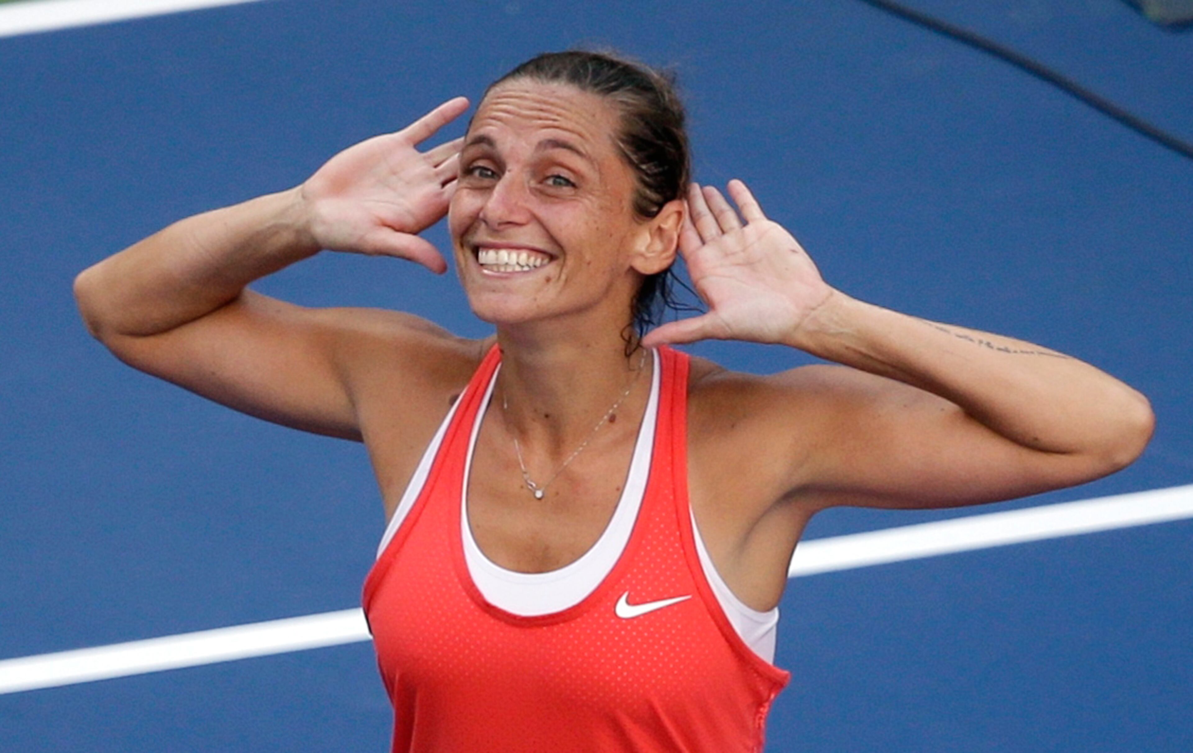 Roberta Vinci, of Italy, reacts to the crowd after beating Serena Williams during a semifinal match at the U.S. Open tennis tournament, Friday, Sept. 11, 2015, in New York. (AP Photo/Seth Wenig)