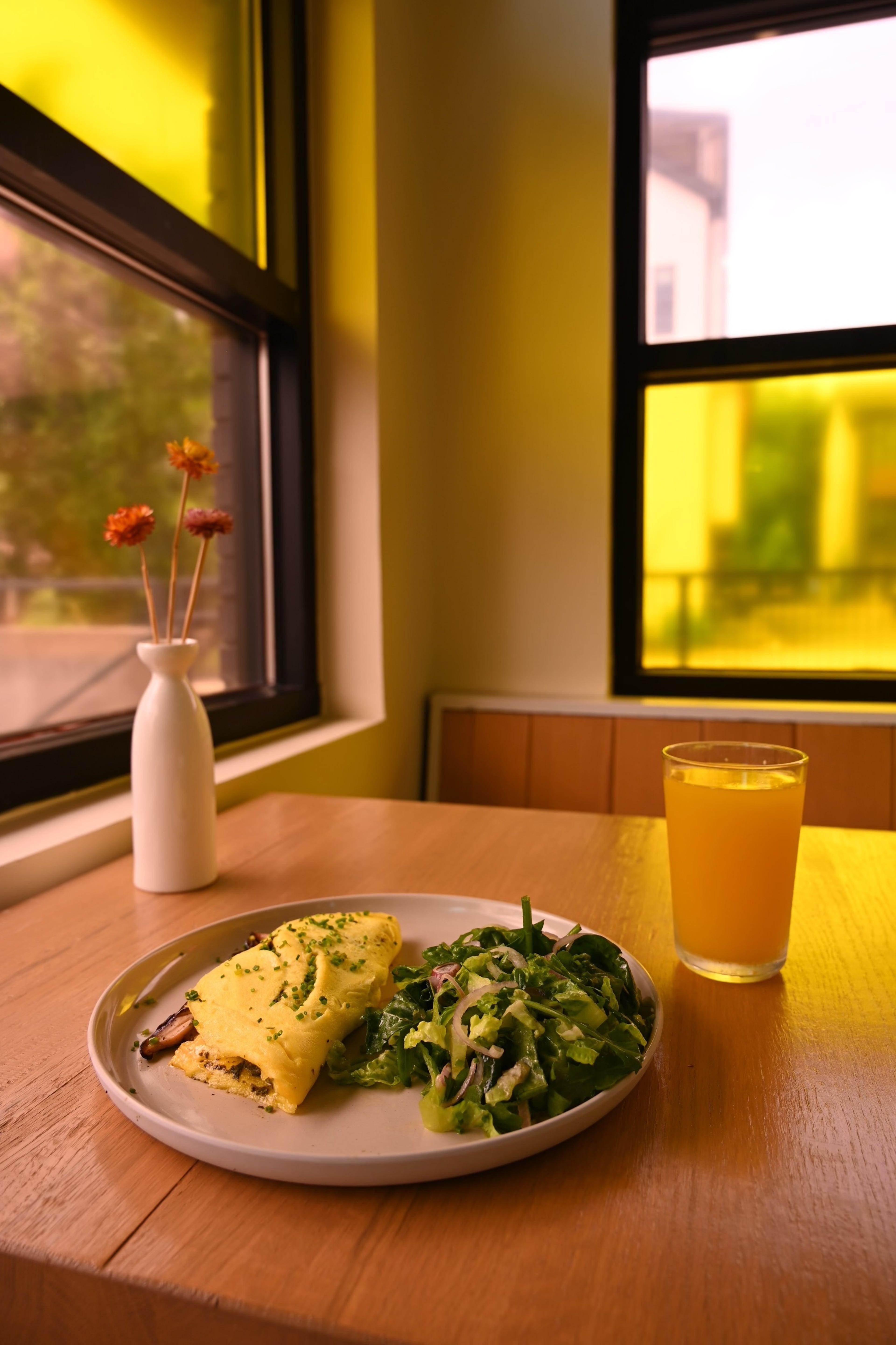 A spinach and Gruyere omelet is served with a green salad at Babygirl. (Courtesy of Babygirl)