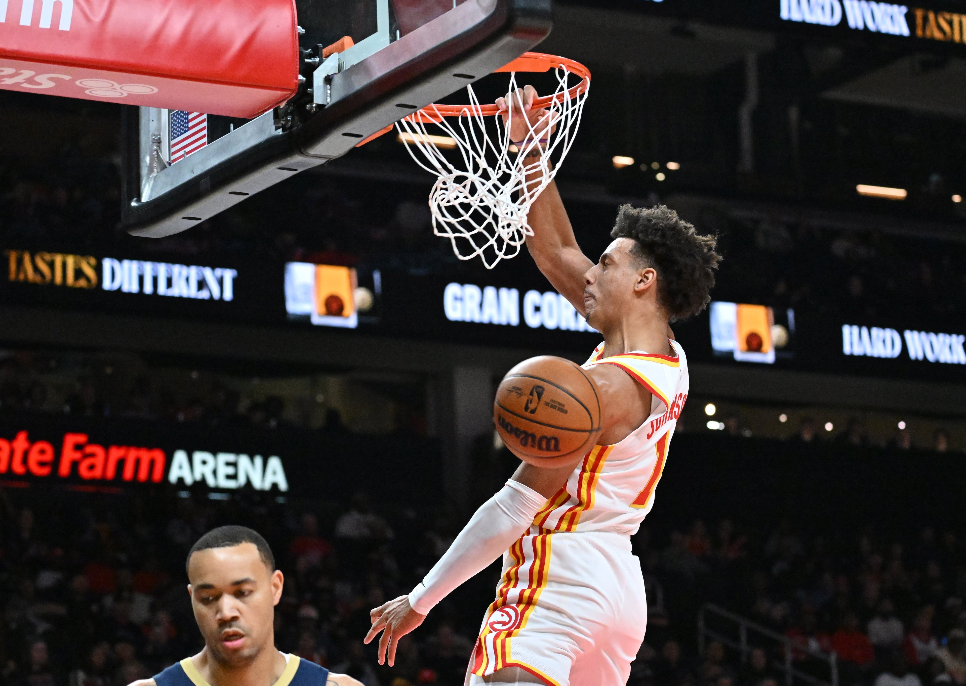 Atlanta Hawks forward Jalen Johnson (1) goes to the basket for dunking the ball during the first half in an NBA basketball game at State Farm Arena, Wednesday, Jan. 7, 2026, in Atlanta. (Hyosub Shin/AJC)