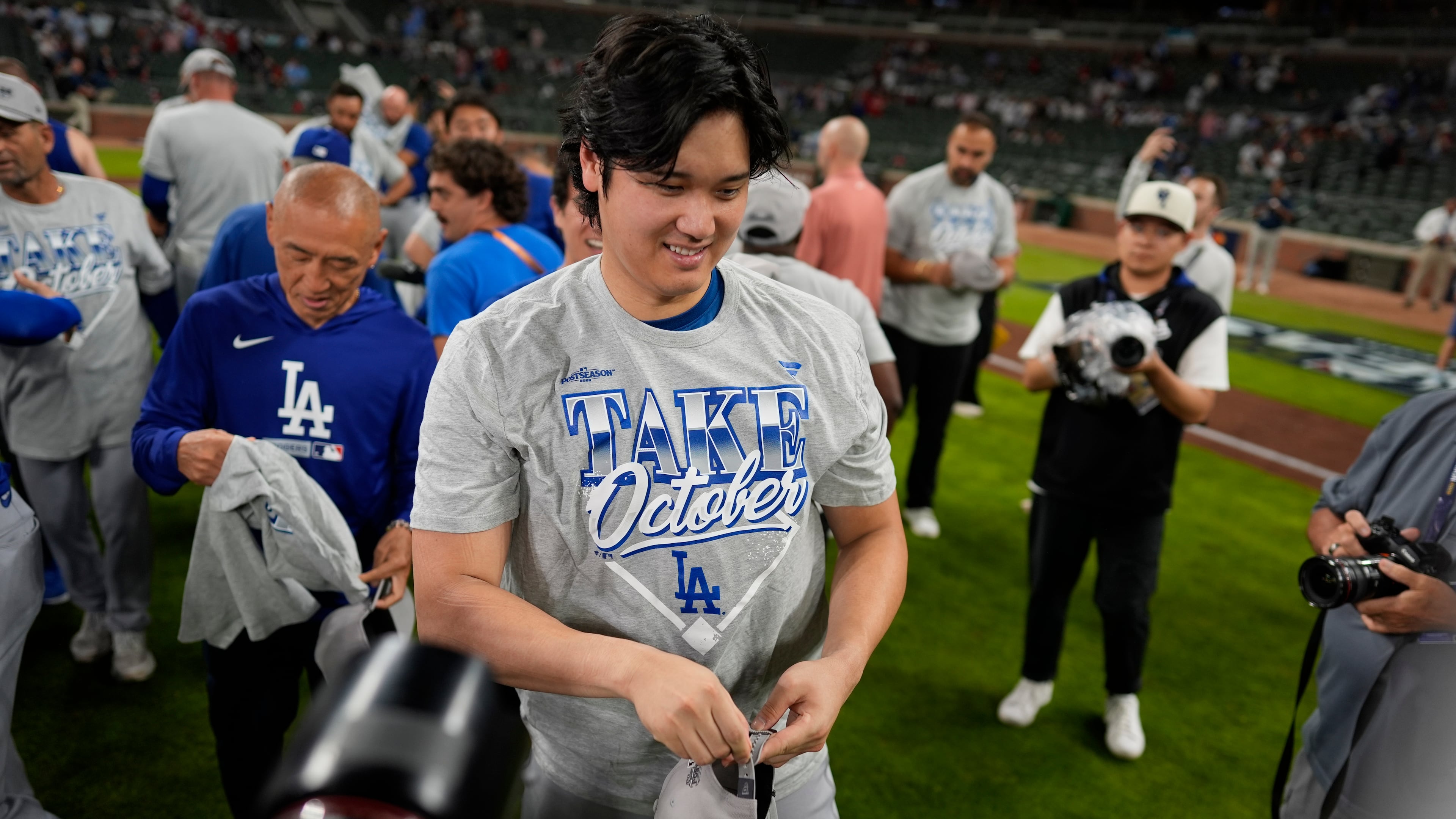 Los Angeles Dodgers two-way player Shohei Ohtani celebrates winning Game 4 of baseball's National League Division Series against the Atlanta Braves, Wednesday, Oct. 7, 2026, in Atlanta. (AP Photo/Mike Stewart)