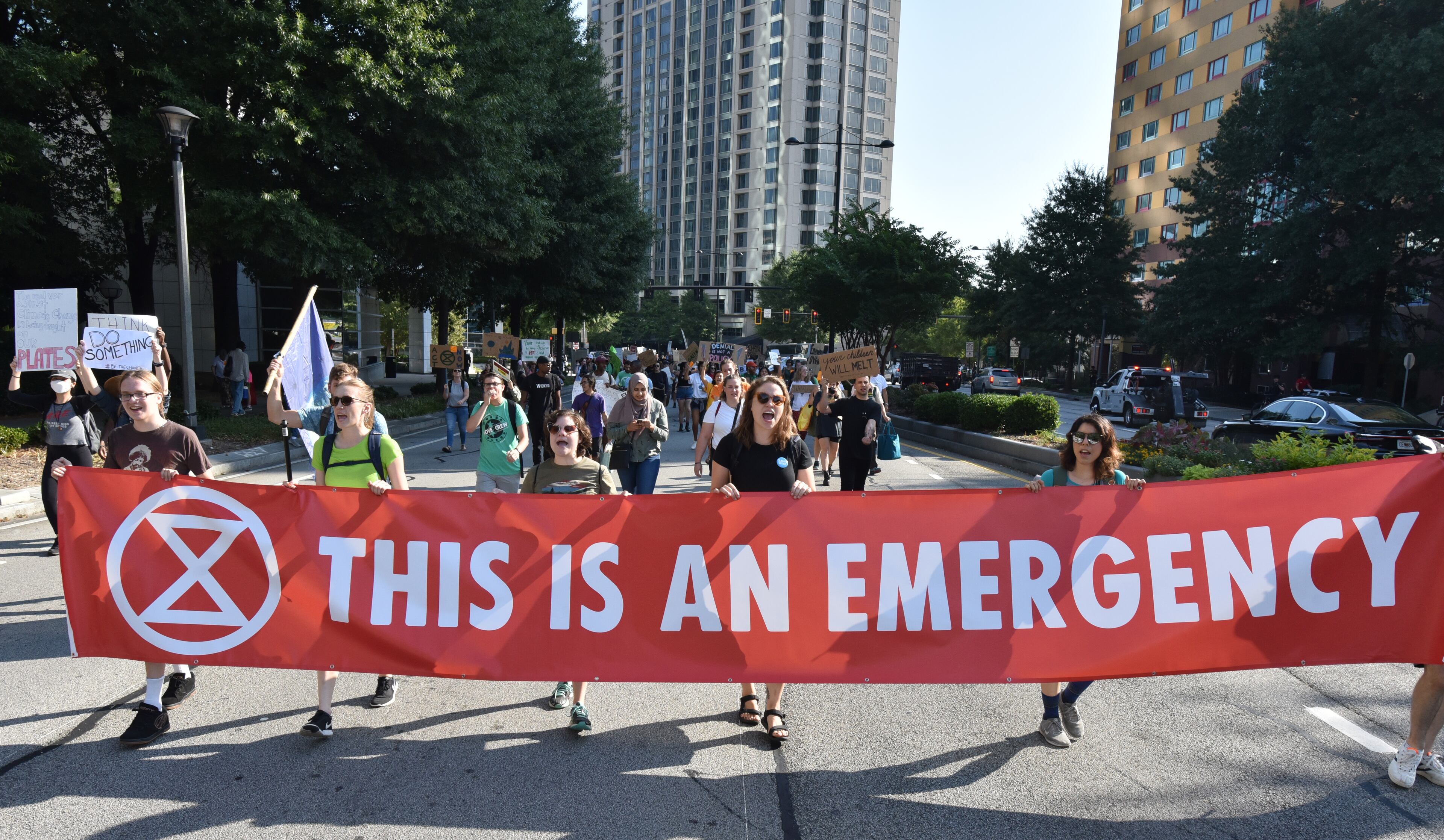 September 27, 2019 Atlanta - Protesters march on Peachtree Road near Buckhead MARTA transit station during Southeast Climate Strike and Rebellion on Friday, September 27, 2019. Area youth, mainly college students, are set to hold a Southeast Climate Strike and Rebellion at Buckhead MARTA transit station on Friday. (Hyosub Shin / Hyosub.Shin@ajc.com)