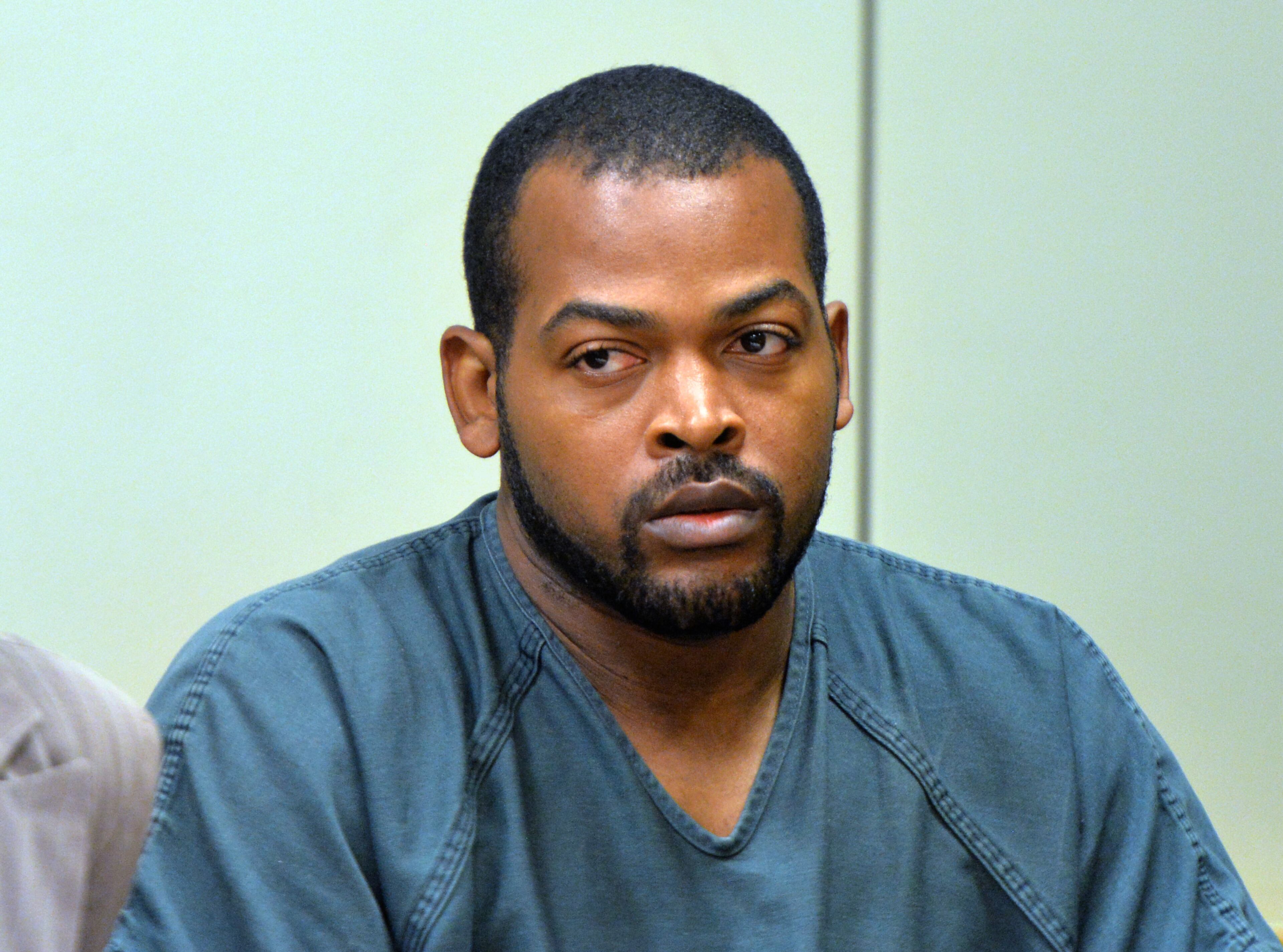 July 10, 2014 Lawrenceville - Recardo Wimbushat (right) sits next to his defense attorney Teri Thompson during a hearing before Gwinnett chief magistrate Christina Blum at Gwinnett Magistrate Court in Lawrenceville on Thursday, July 10, 2014. Bond has been denied for Recardo and Therian Wimbush being held on child cruelty charges that they kept their oldest child a prisoner in their home. HYOSUB SHIN / HSHIN@AJC.COM