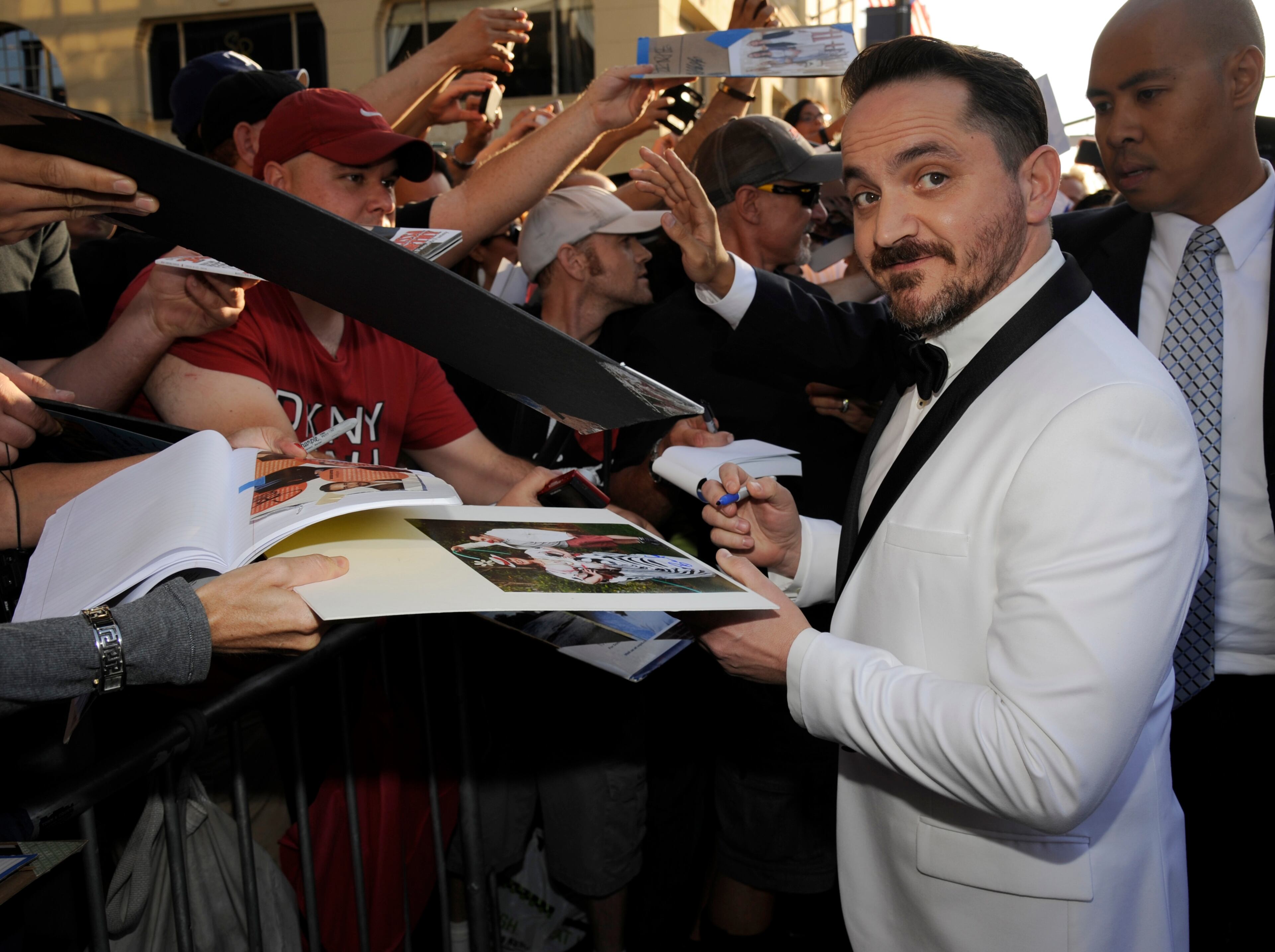 Ben Falcone signs autographs as he arrives at the Los Angeles premiere of "Tammy" at the TCL Chinese Theatre on Monday, June 30, 2014. (Photo by Chris Pizzello/Invision/AP)