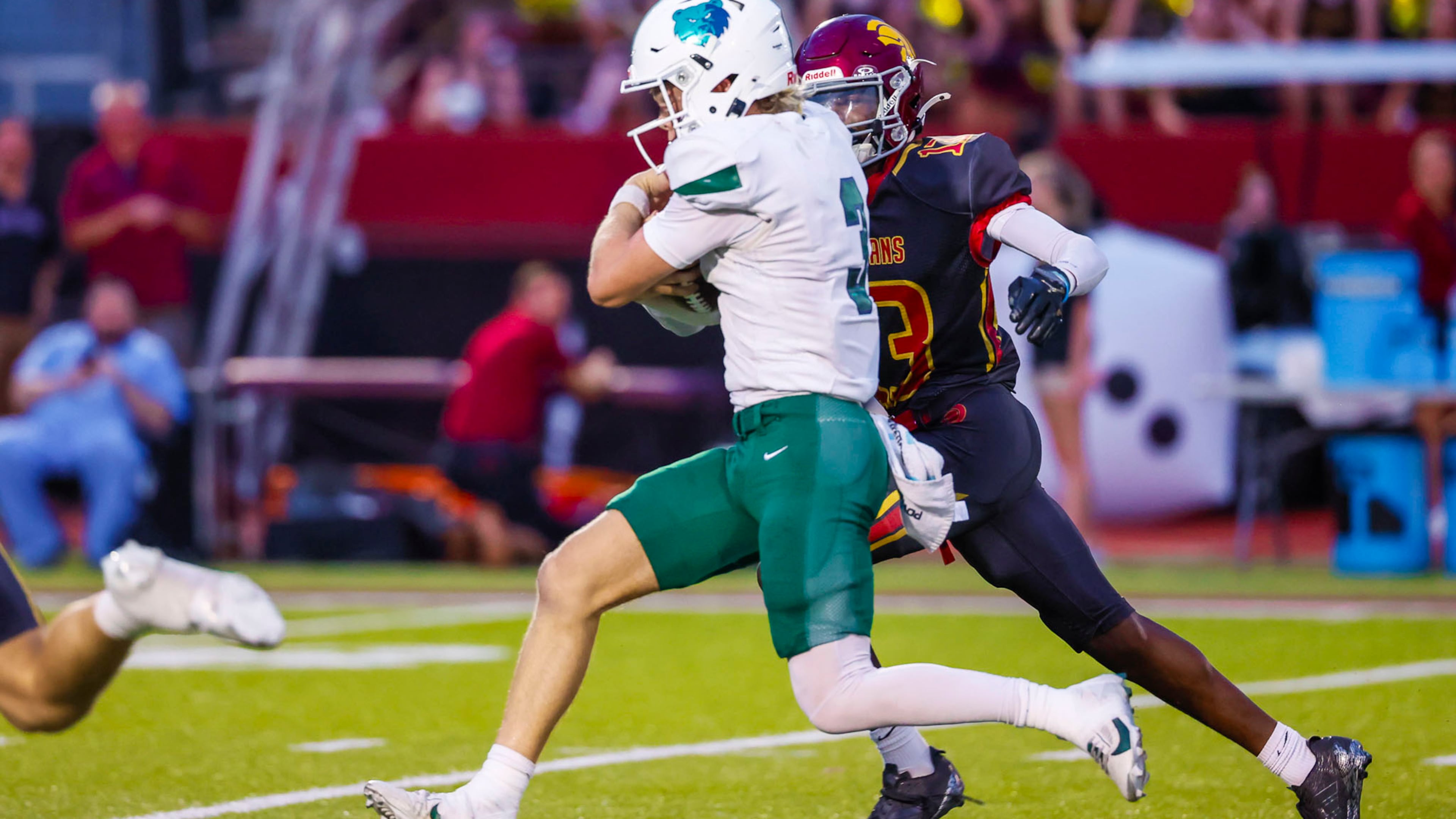 Creekview's Alex Penrod (front) attempts a run during the first half against Lassiter High School on Friday, Sept. 5, 2025, in Marietta. Penrod ran for two first-half touchdowns and passed for another. (Oscar Guevara Saenz for the AJC)