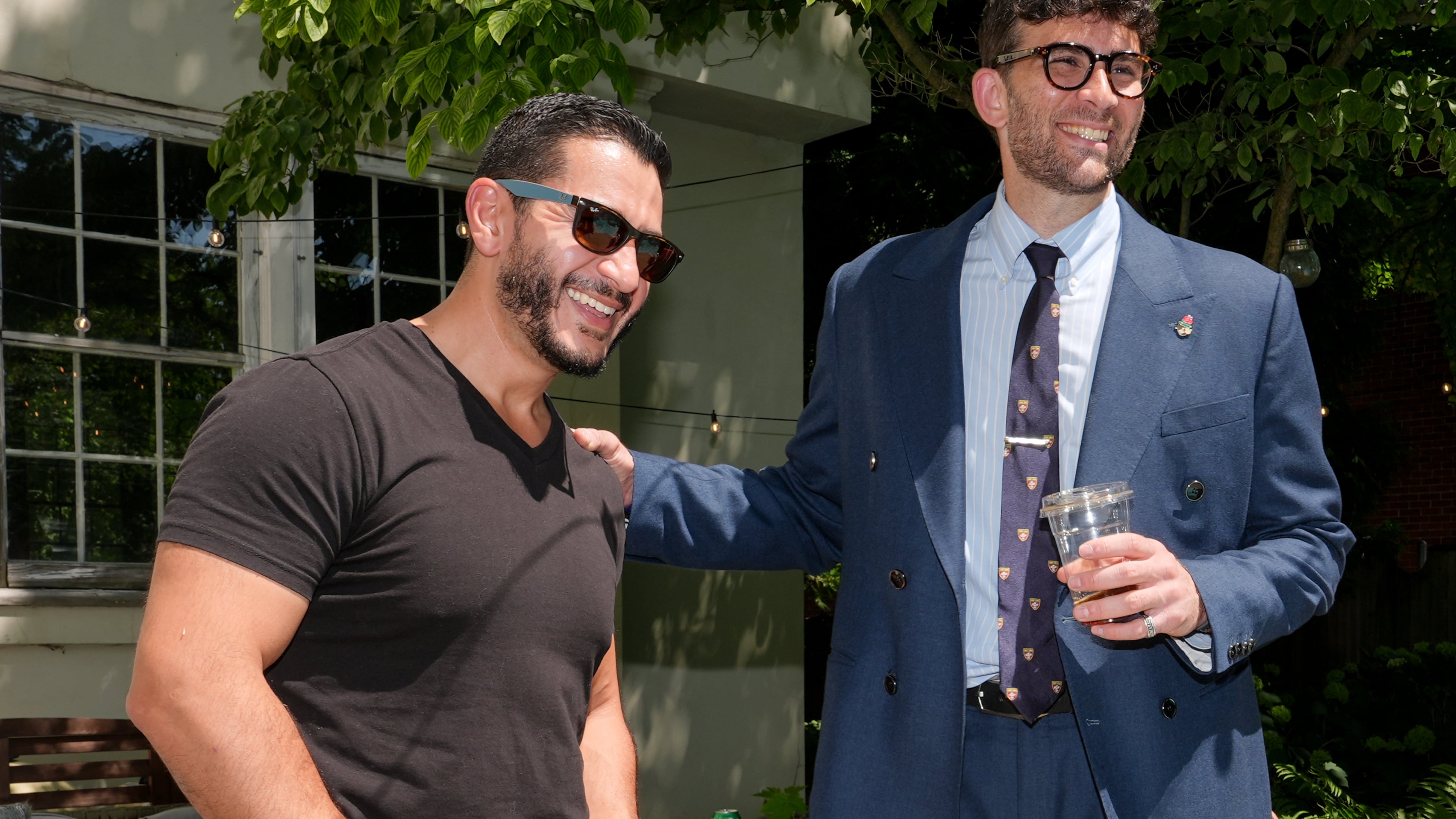 Abdul El-Sayed, a progressive candidate in the Democratic primary for U.S. Senate in Michigan, talks poolside with streamer Hasan Piker at a party for content creators supporting his campaign, Monday, Aug. 3, 2026, in Detroit. (AP Photo/Julia Demaree Nikhinson)