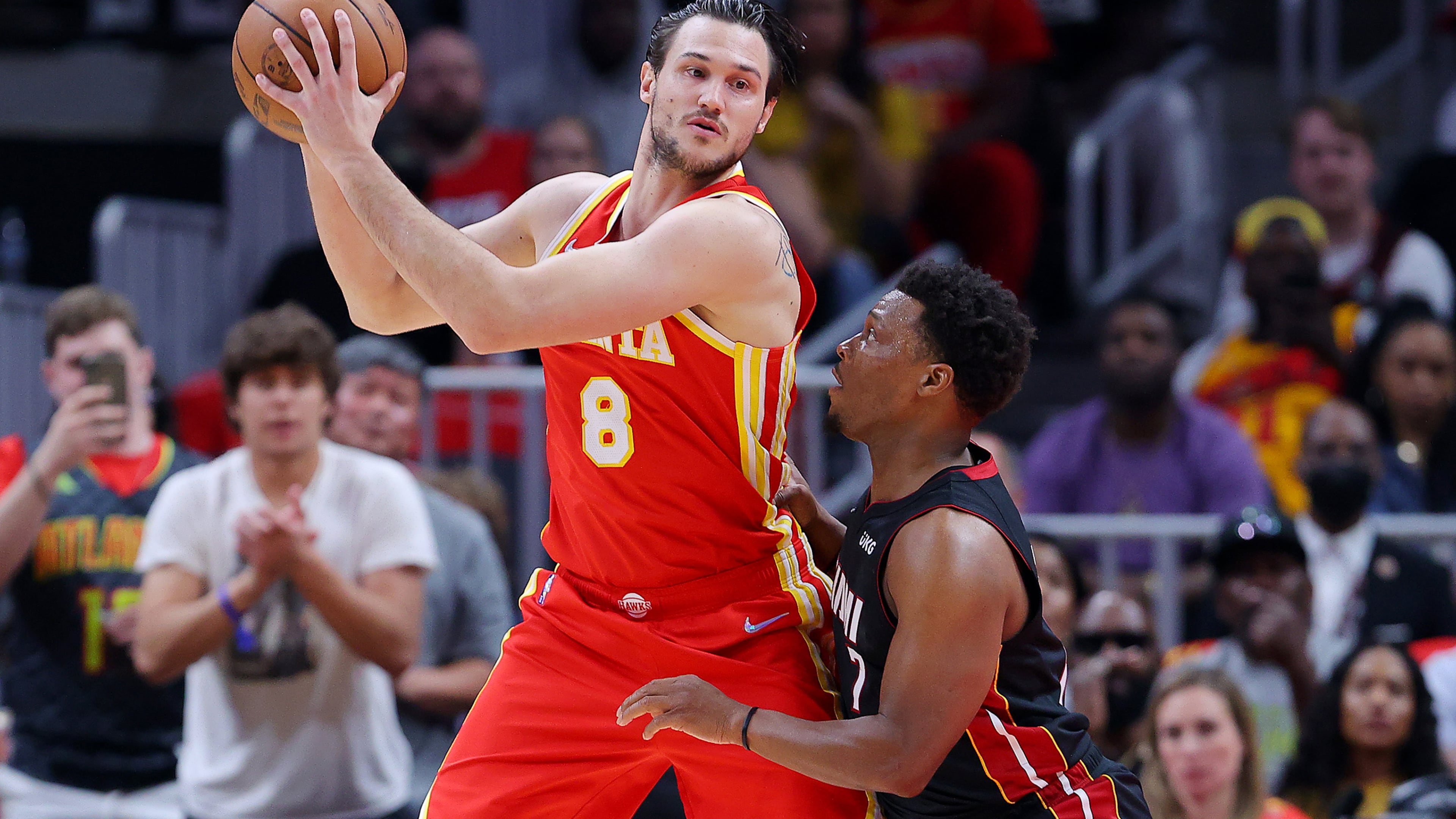 The Atlanta Hawks' Danilo Gallinari (center) works against the Miami Heat's Kyle Lowry during Game 3 of an Eastern Conference first-round playoff series at State Farm Arena on April 22, 2022, in Atlanta. (Kevin C. Cox/Getty Images/TNS)