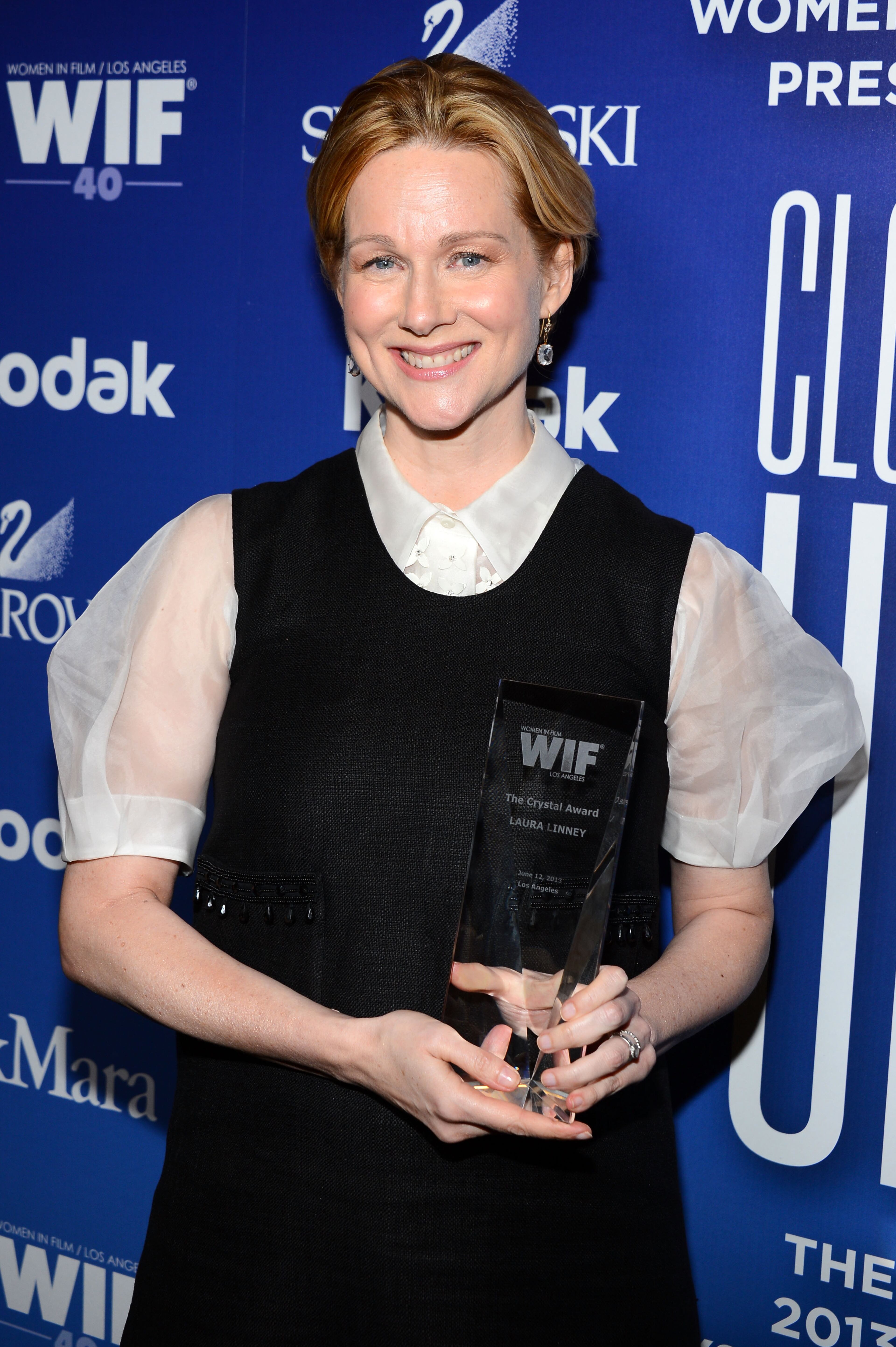 BEVERLY HILLS, CA - JUNE 12: Actress Laura Linney poses with the Crystal Award for Excellence in Film backstage at Women In Film's 2013 Crystal + Lucy Awards at The Beverly Hilton Hotel on June 12, 2013 in Beverly Hills, California. (Photo by Mark Davis/Getty Images for Women In Film)