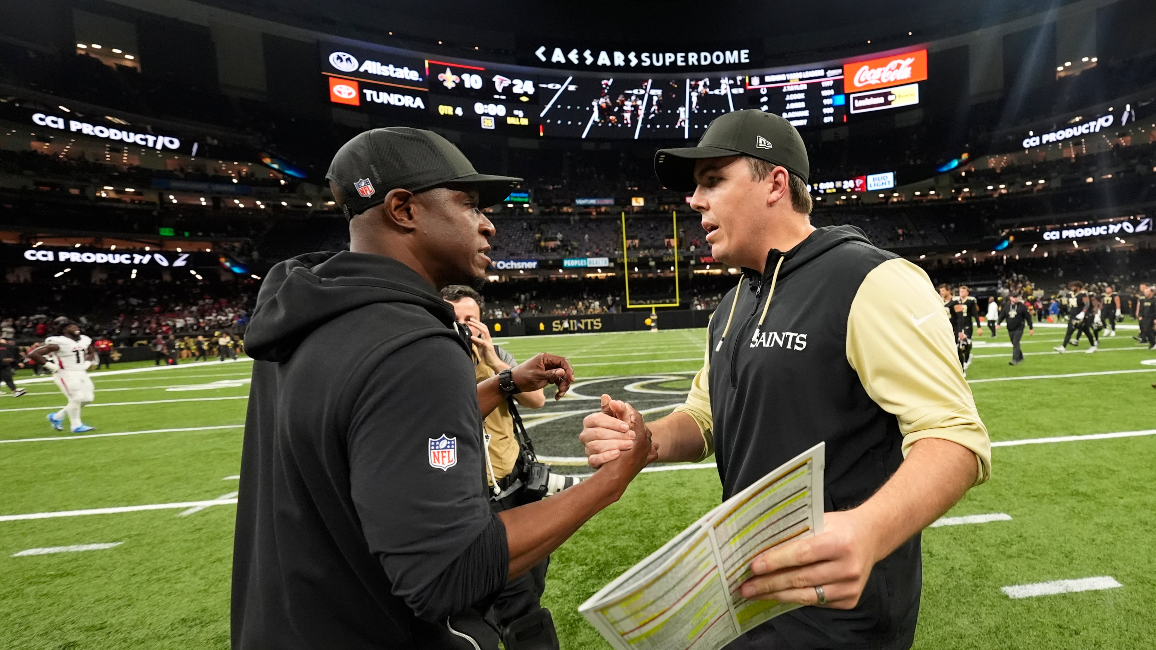 Atlanta Falcons head coach Raheem Morris (left) and New Orleans Saints head coach Kellen Moore shake hands after an NFL football game, Sunday, Nov. 23, 2025, in New Orleans. (Gerald Herbert/AP)