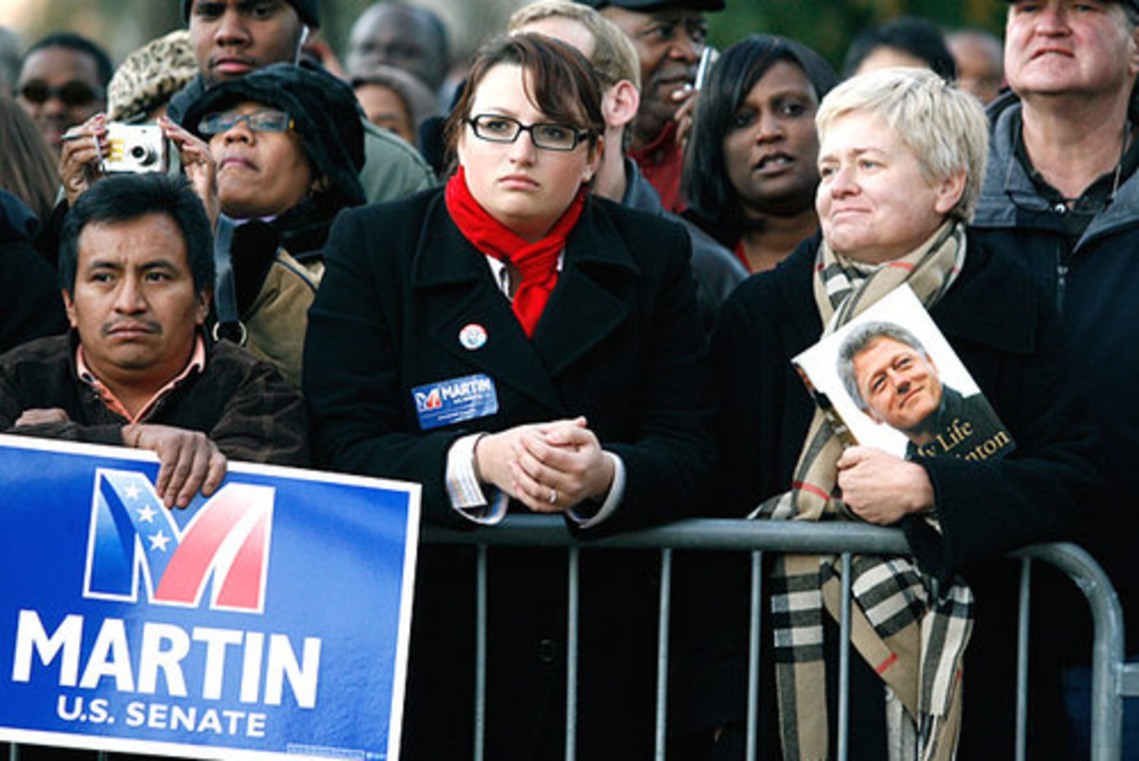 Jim Martin supporters, including Victor Villatoro, Jackie Frankovich and Deborah Cross (from left), wait for the start of the rally. "It's important for us to reach 60," Cross said. Democrats are getting closer to holding 60 votes in the U.S. Senate, enough to end filibusters.