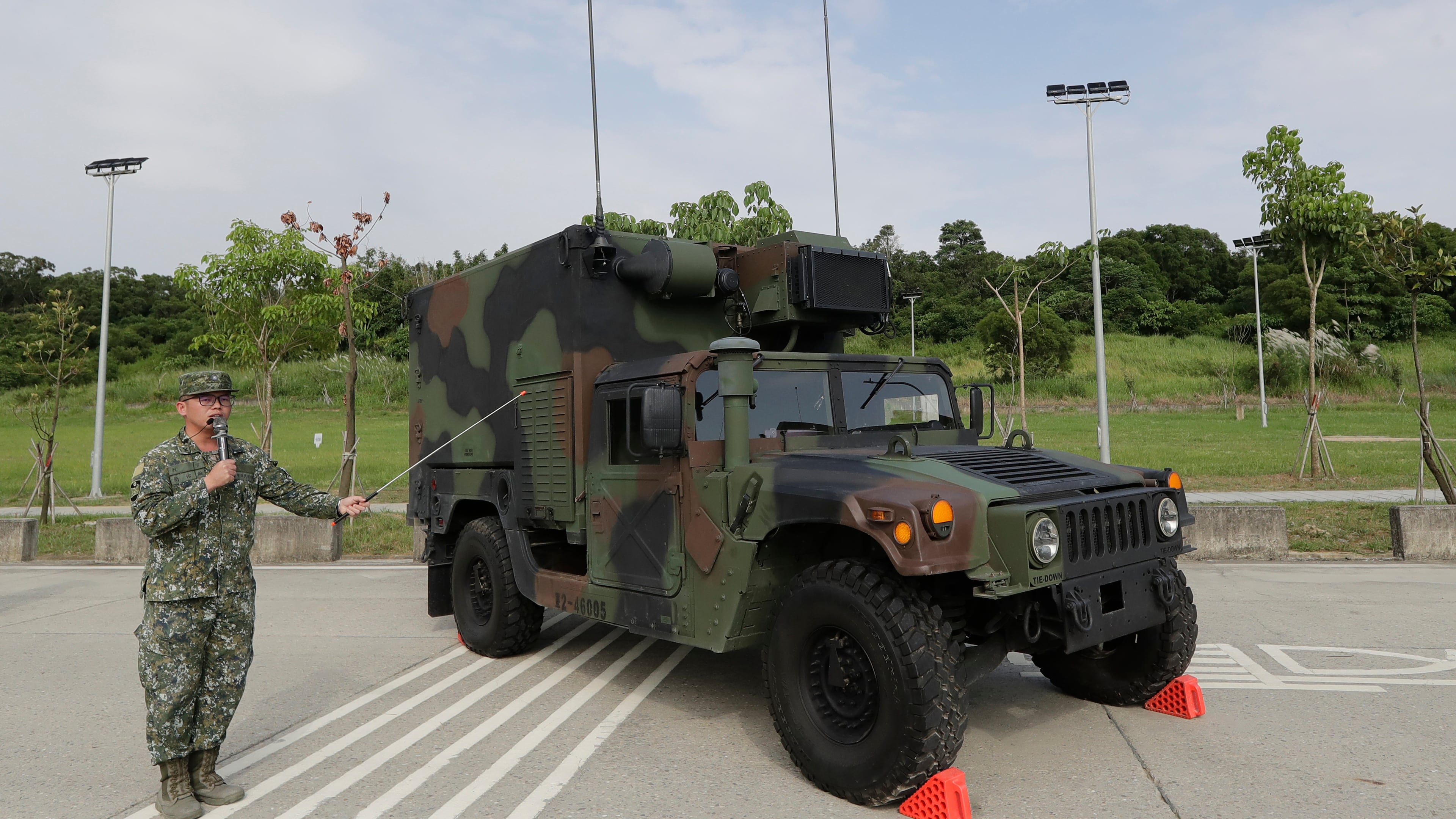A soldier briefing a specialized HIMARS (M142 High Mobility Artillery Rocket System) command and control vehicle based on an M152A1 HMMWV during a media event in Tainan, Southern Taiwan, Tuesday, Sept. 22, 2026. (AP Photo/Chiang Ying-ying)