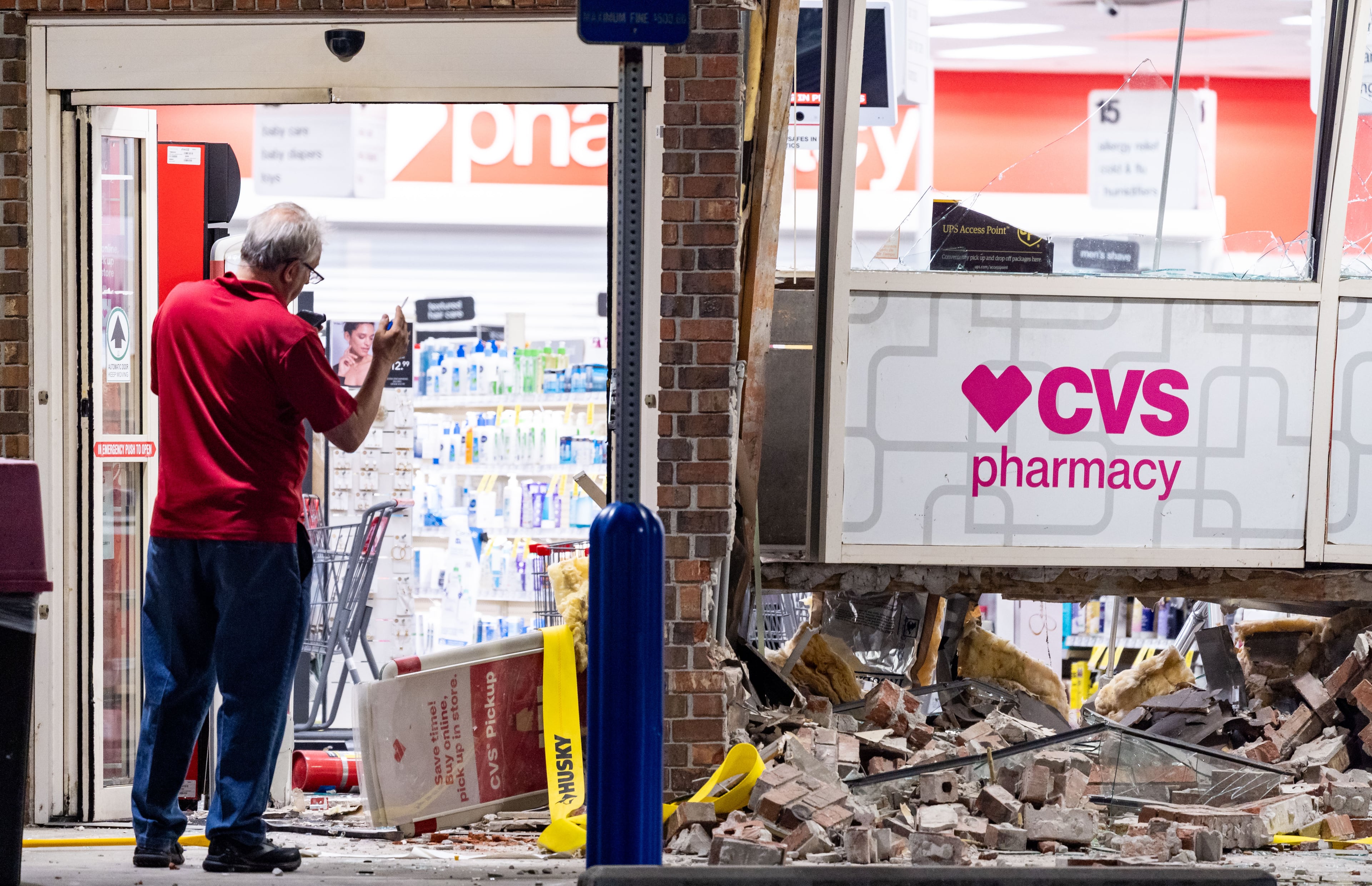 Smash-and-grab burglars hit a CVS Pharmacy in DeKalb County on Thursday in an attempt to steal the store's ATM. Part of the store's brick facade was caved in where the suspects tried to rip out the machine. A yellow tie-down strap was left behind.