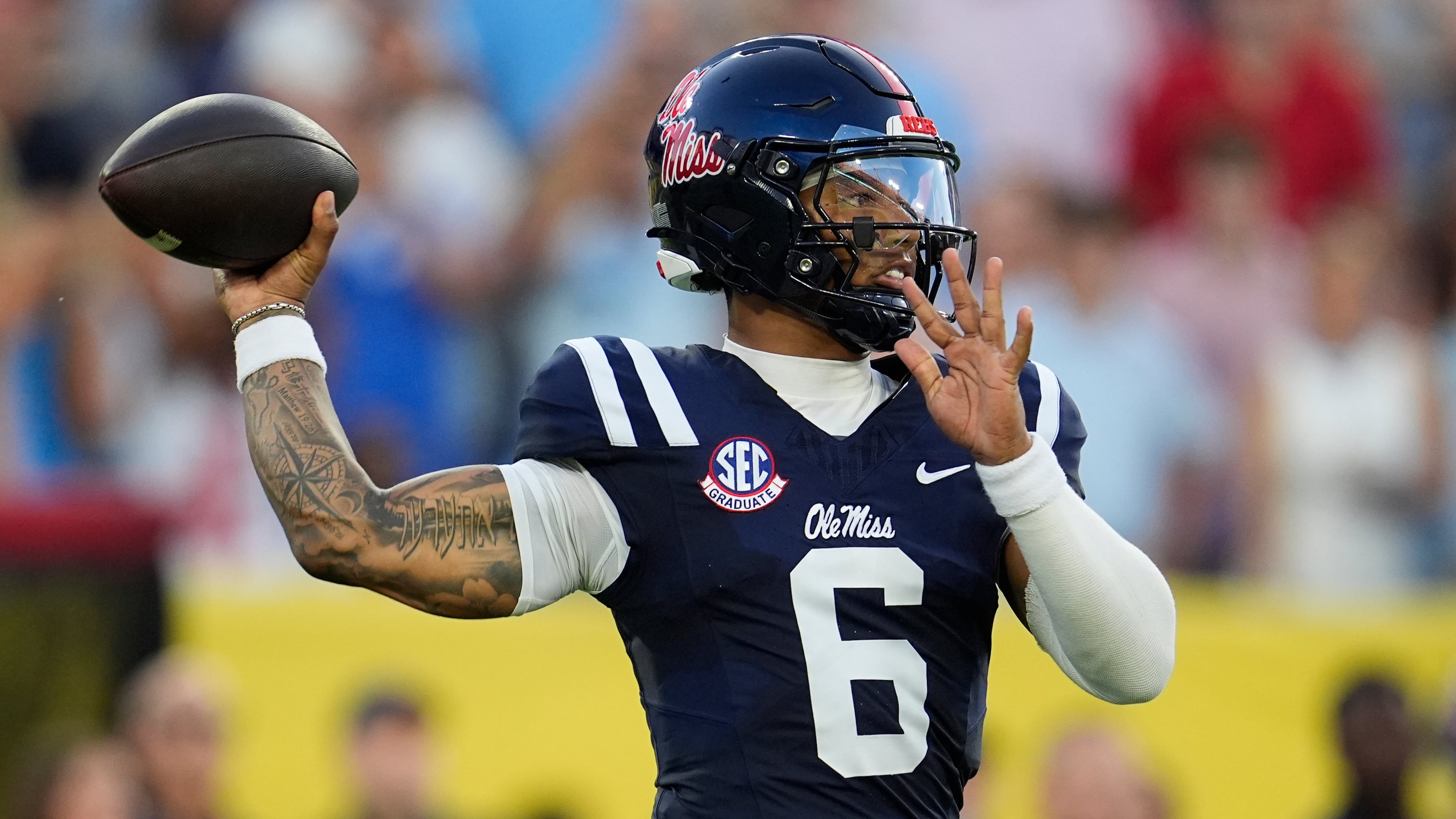 Mississippi quarterback Trinidad Chambliss (6) looks to throw a pass during the first half of an NCAA college football game against Louisville, Sunday, Sept. 6, 2026, in Nashville, Tenn. (AP Photo/George Walker IV)