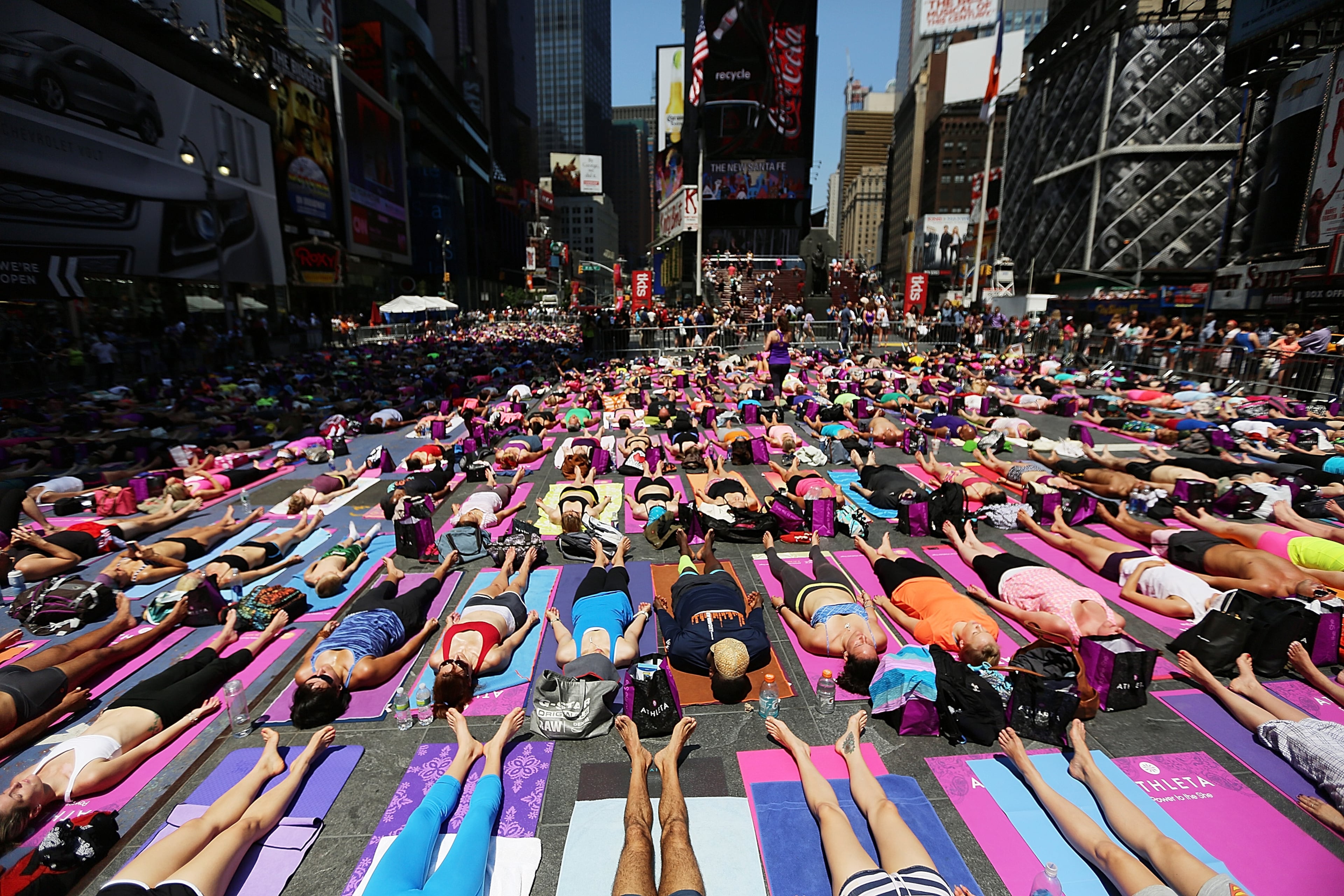 NEW YORK, NY - JUNE 21: Enthusiasts perform yoga in Times Square during an event marking the summer solstice on June 21, 2013 in New York City. Thousands of yogis will attend the free day-long event in Manhattan on the longest day of the year. (Photo by Mario Tama/Getty Images)