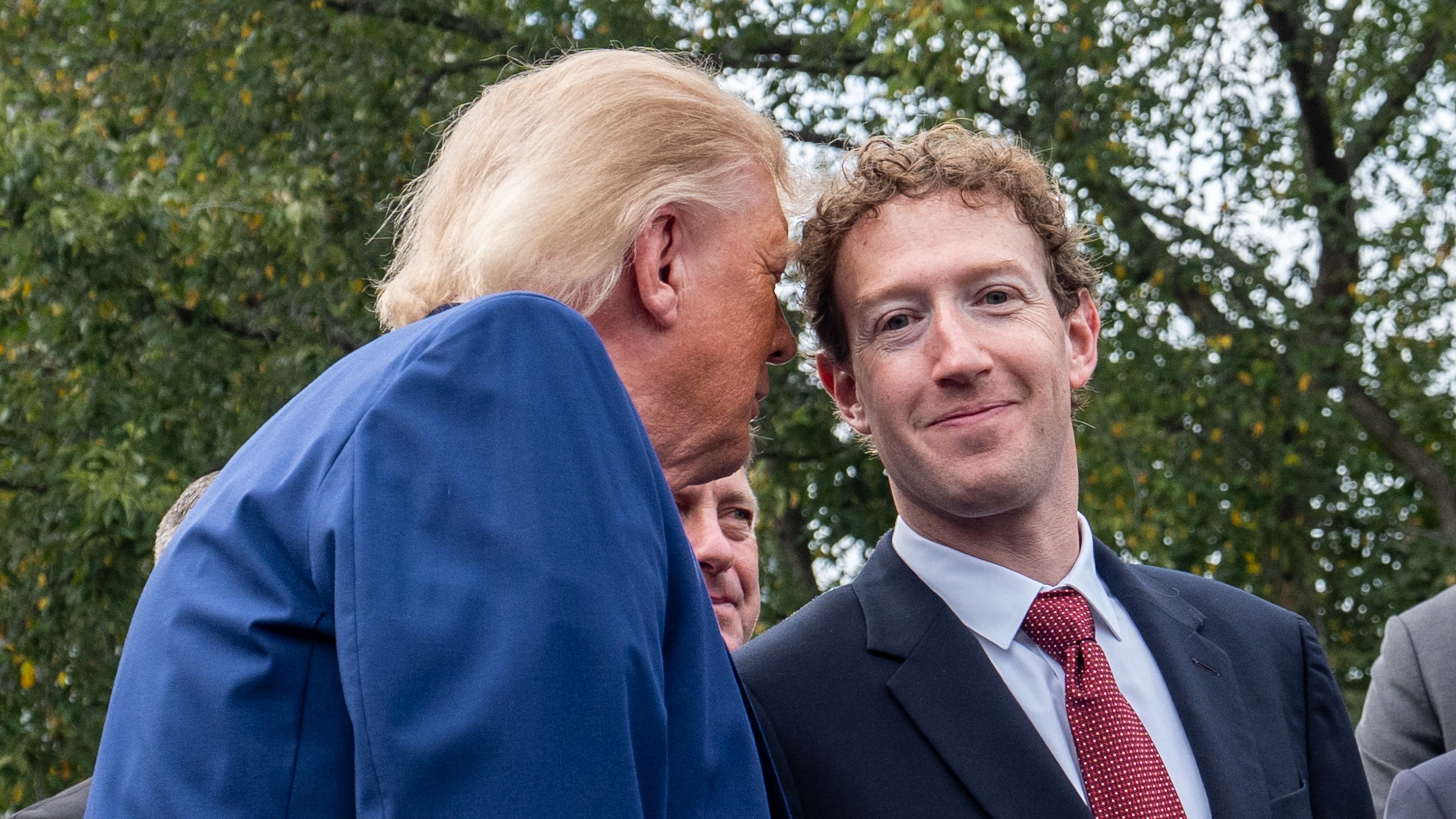 President Donald Trump talks with Meta CEO Mark Zuckerberg as he speaks with reporters outside the West Wing of the White House, Tuesday, Sept. 29, 2026, in Washington. (AP Photo/Alex Brandon)